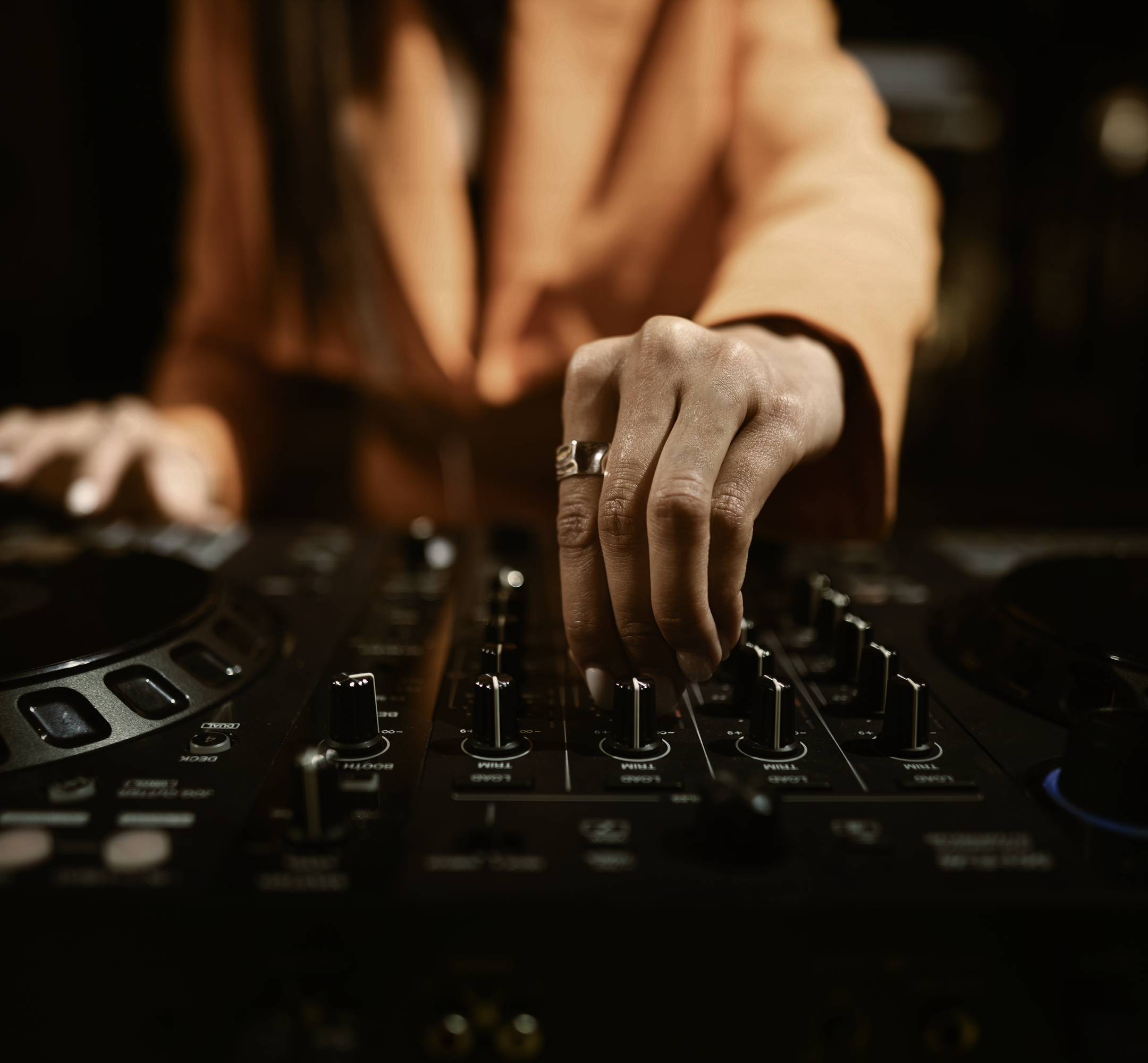 DJ adjusting turntable.