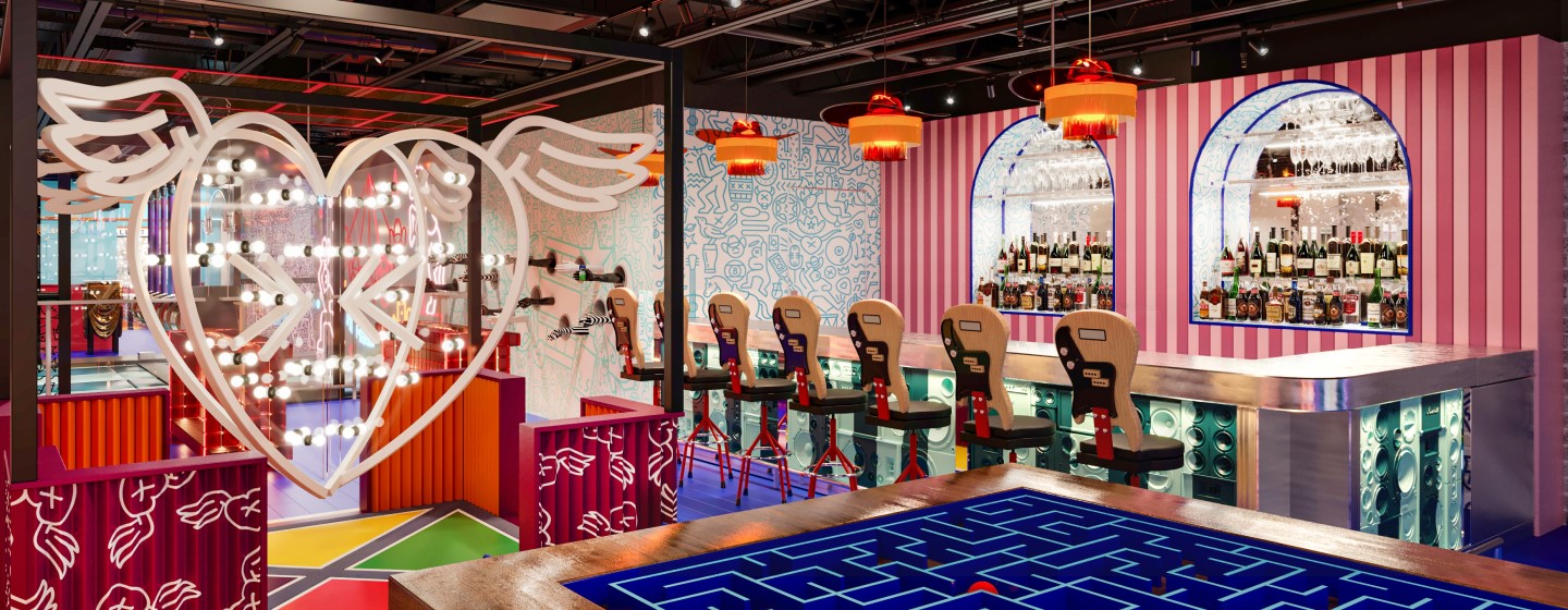 Bar area, table game, and heart neon sign at Play Playground at Nashville Live!