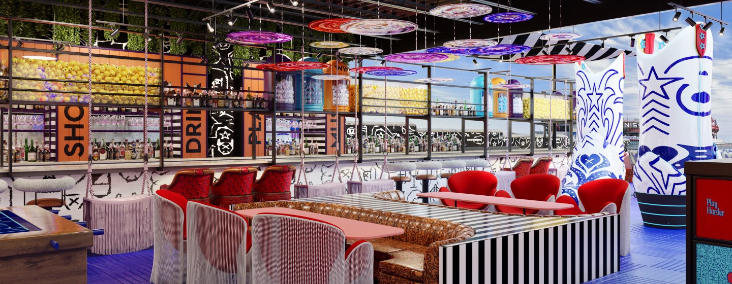 Rooftop bar and dining area with giant blue and white cowboy boots at Play Playground at Nashville Live!