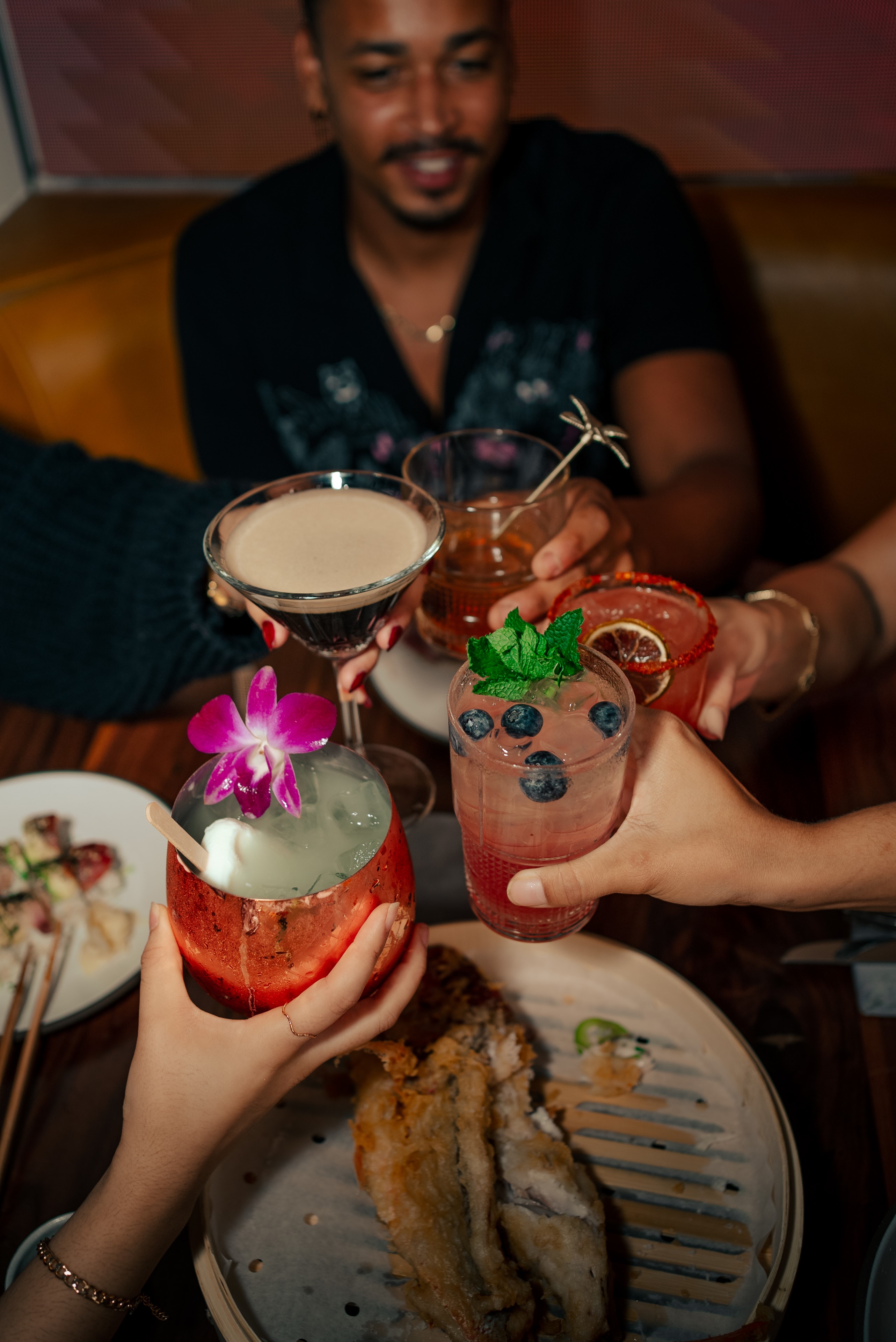 Group toasting tropical cocktails.