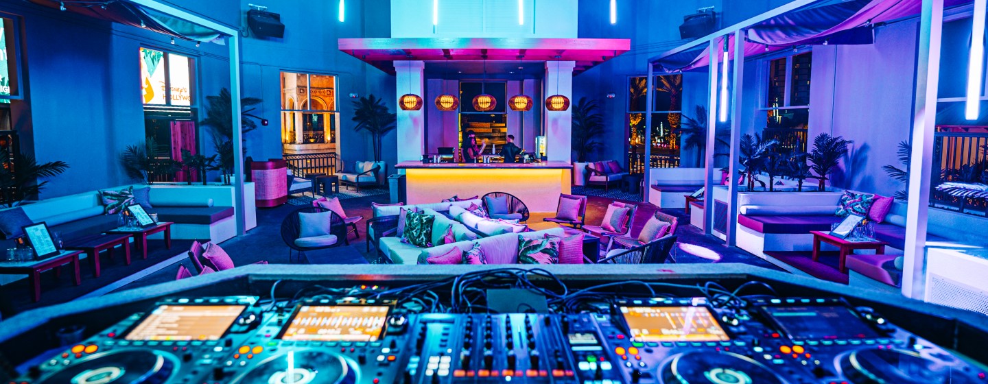 View of the Palm Tree Club lounge area and bar from the DJ booth.