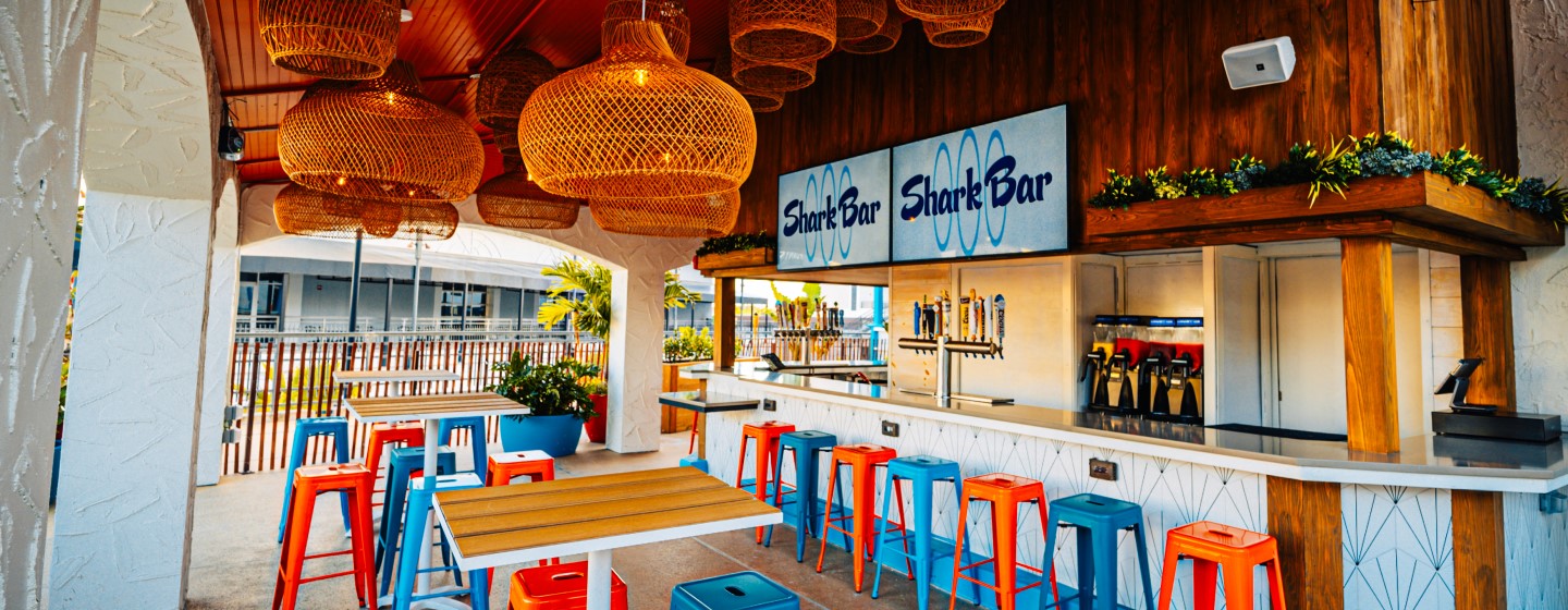 Patio dining and bar at Shark Bar, Live! at the Pointe Orlando.