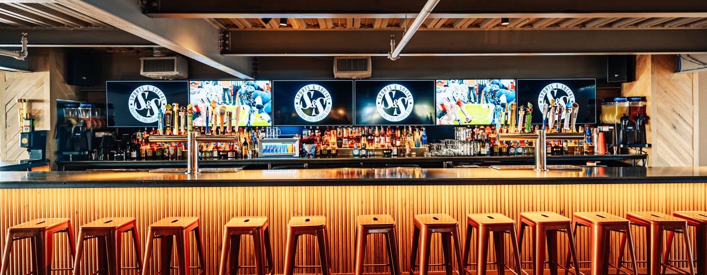 Fully stocked bar at Sports & Social at Live! at the Pointe Orlando.