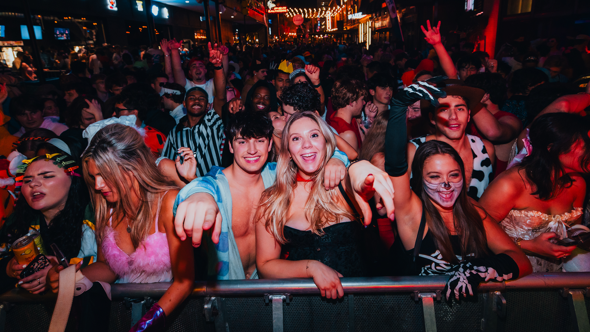 Lively crowd in customs celebrating Halloween