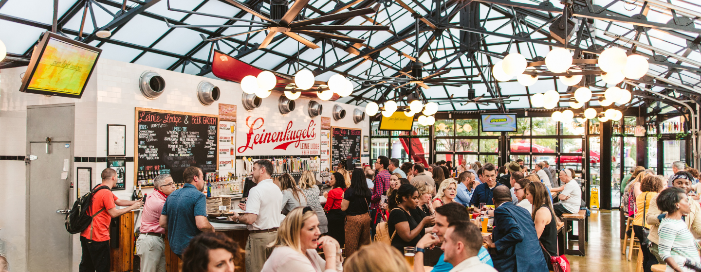 People gathering at Leinie Lodge