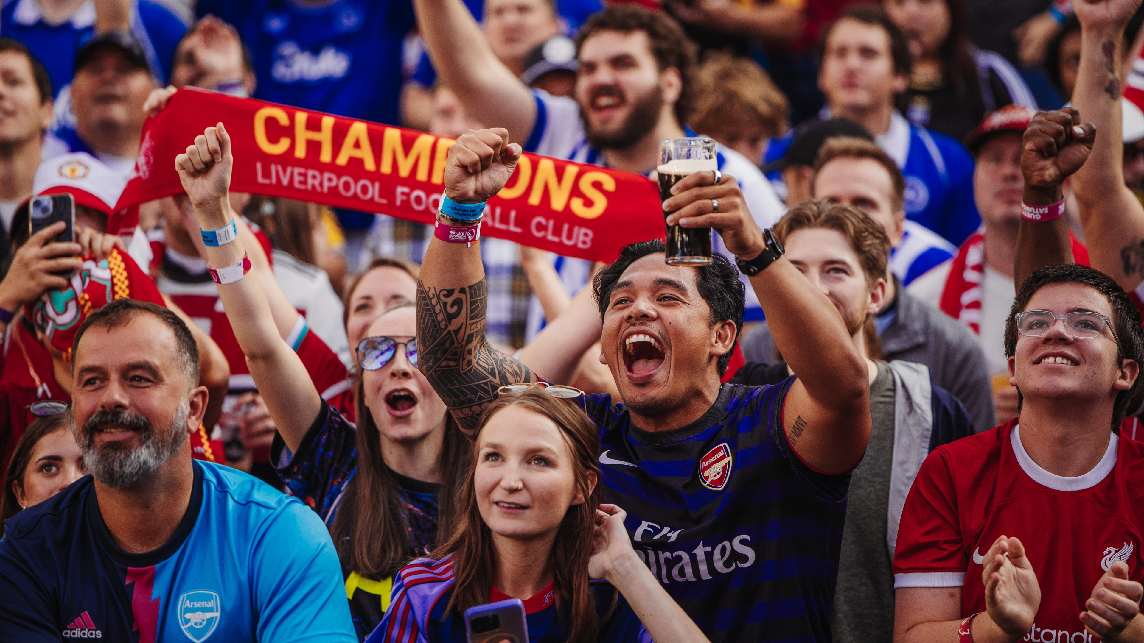 Crowd of soccer fans at tailgate pre-game party.