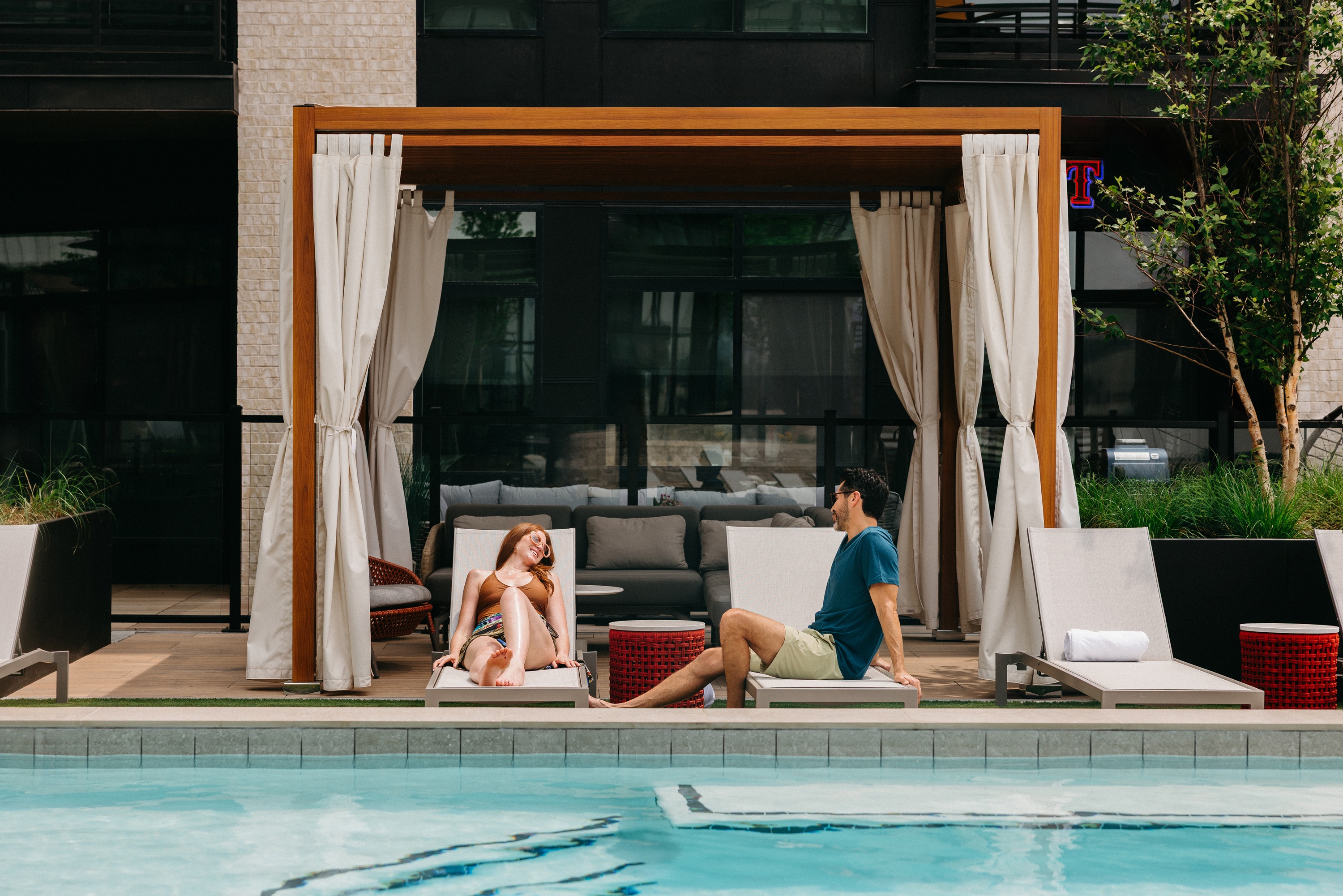 Couple sitting enjoying the cabanas at One Rangers Way
