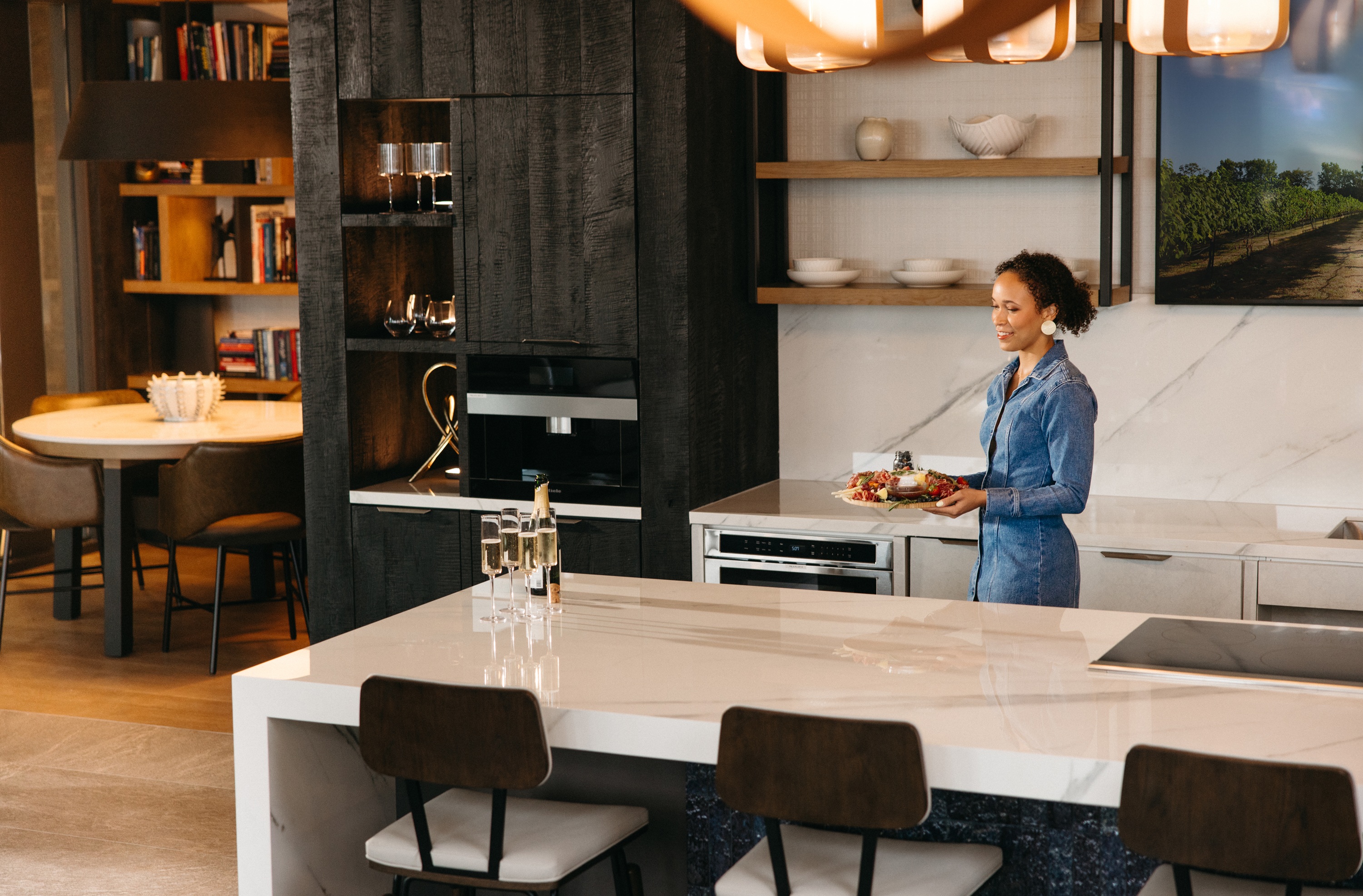 Chef bringing food to a table at One Rangers Way
