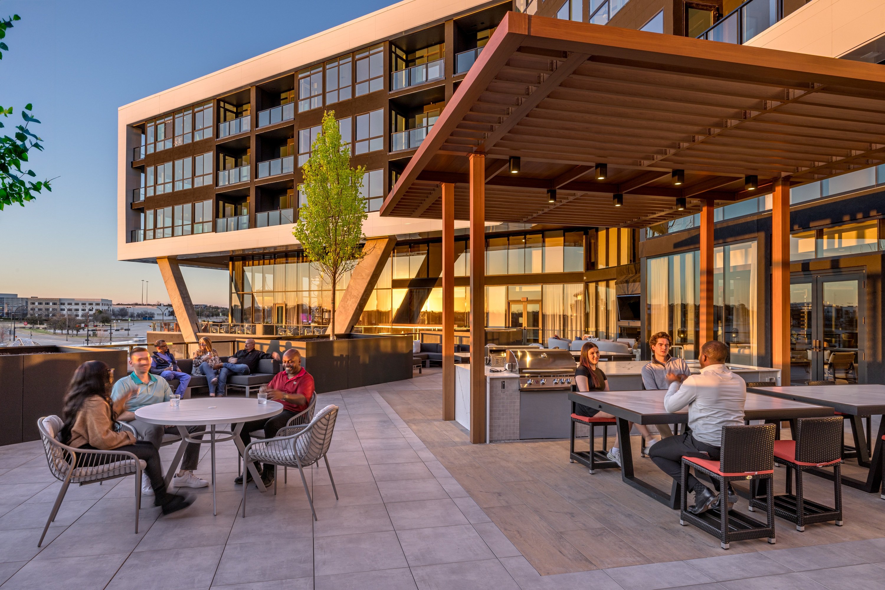 People sitting in an outdoor space at One Rangers Way