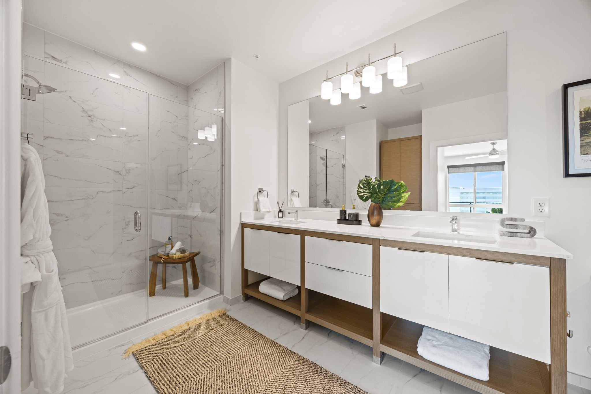 Penthouse primary bathroom with double sink at One Rangers Way