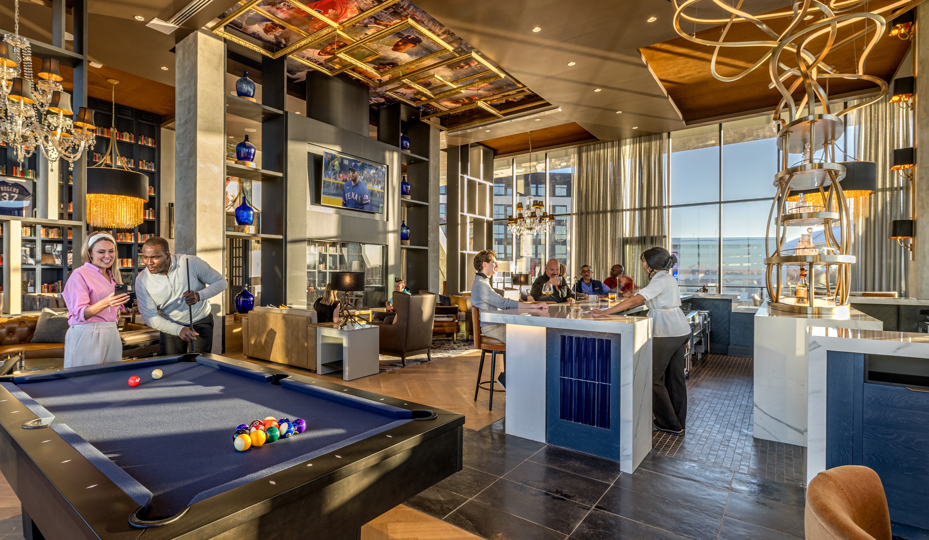 People playing pool and having drinks at the resident club lounge