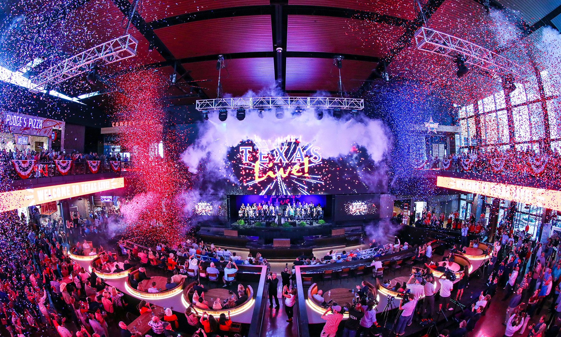 Interior of Live! Arena with full house for show with confetti and smoke at Texas Live!