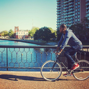 Man riding bike along Elizabeth River Trail.