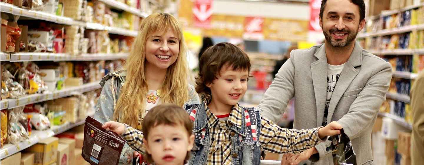 Parents and two children in shopping cart.