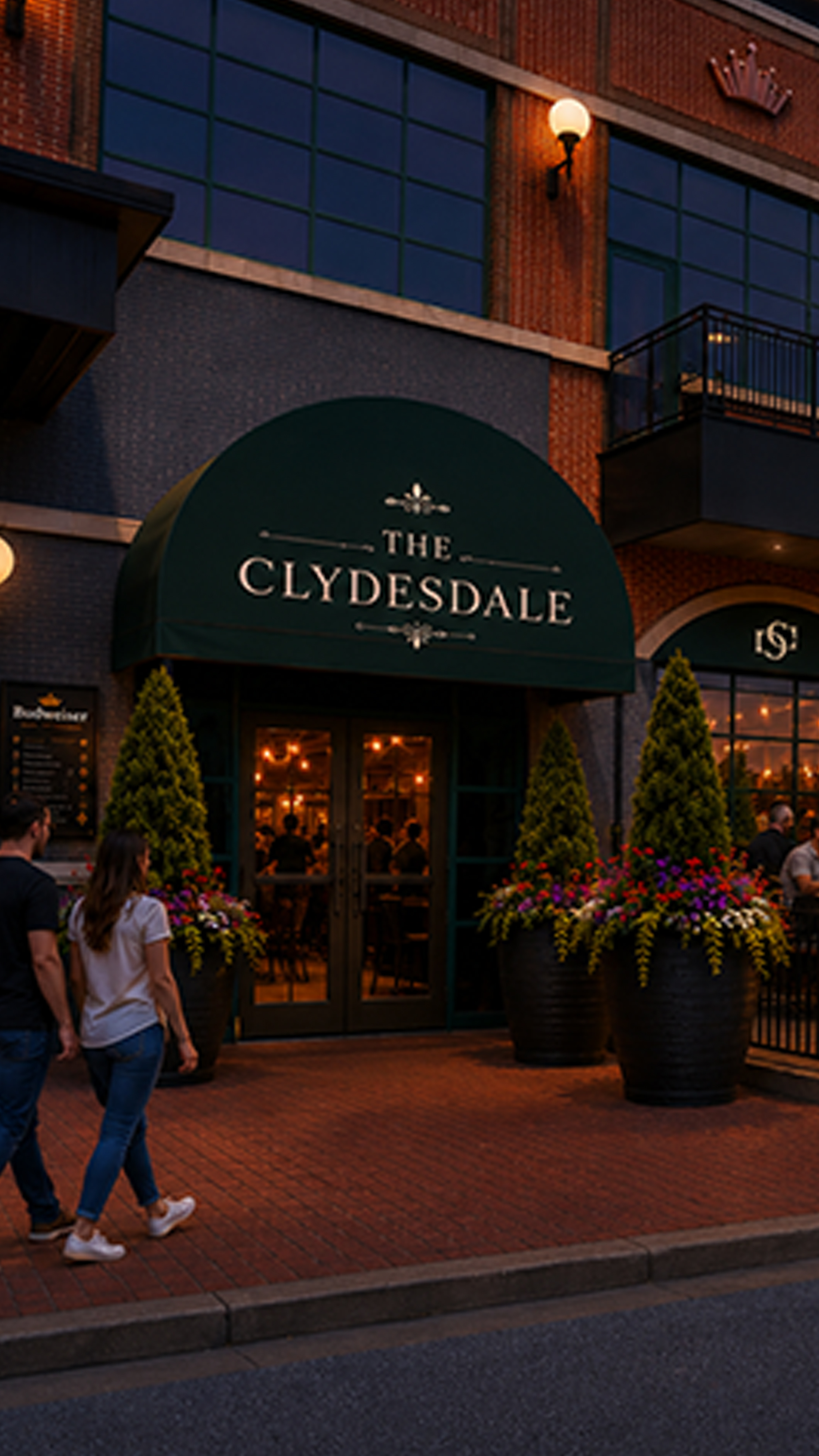 Exterior rendering of The Clydesdale entrance with awning and couple on sidewalk.