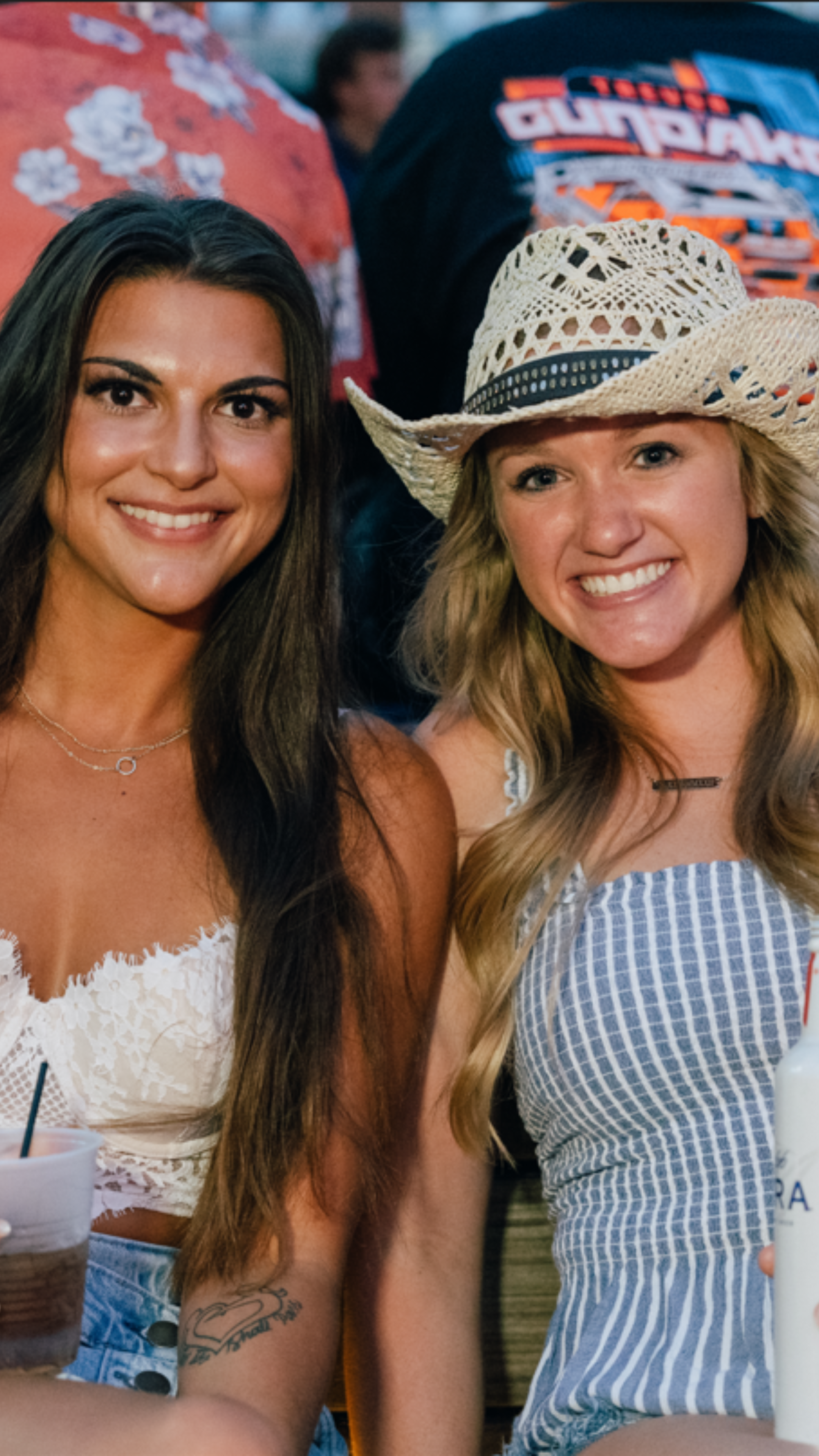 two girls at a country concert