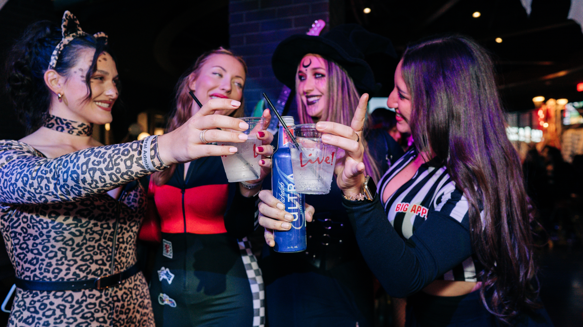 Group of girls at ava garden bar cheer-sing 