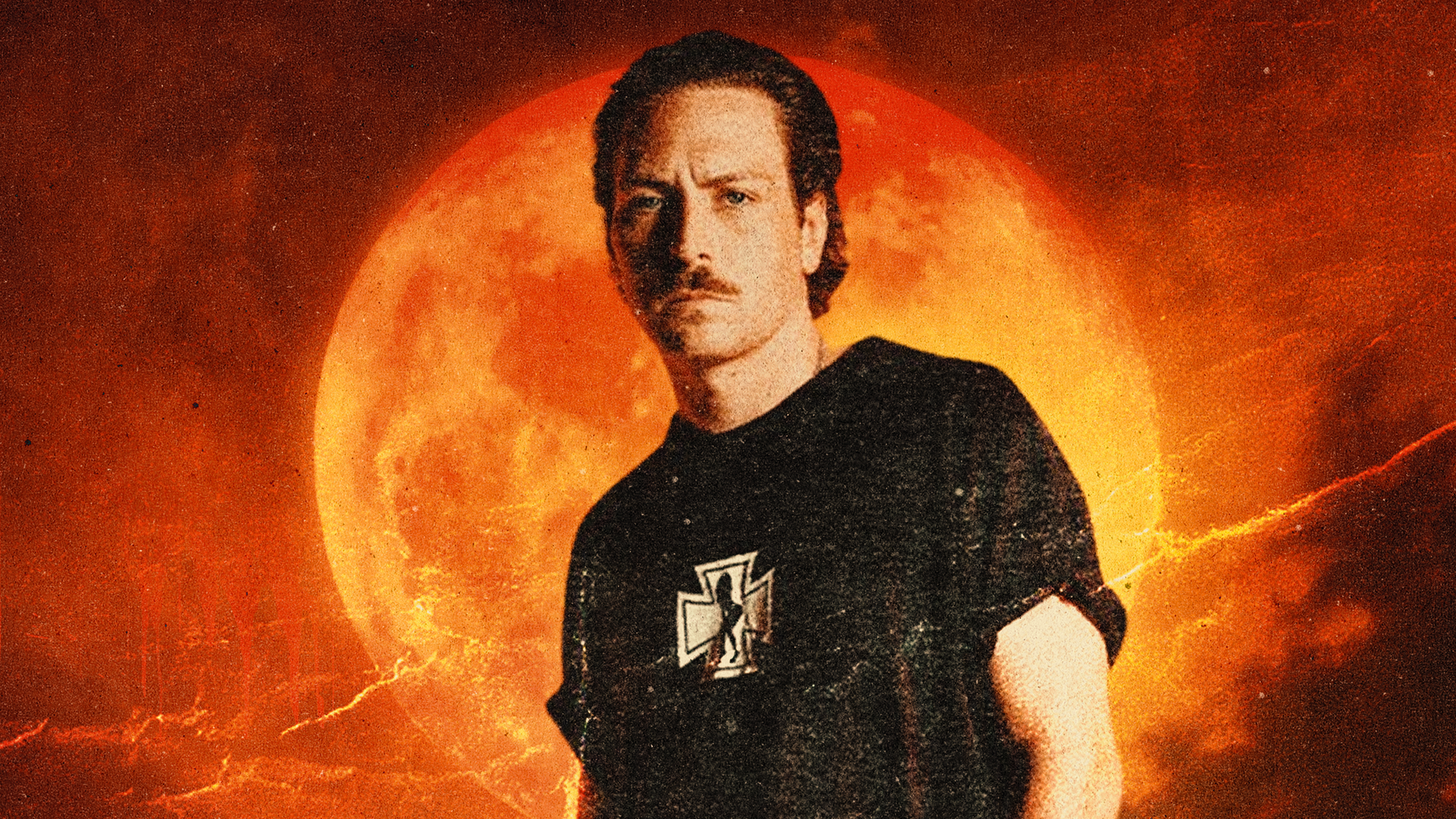 Luke Alexander standing in front of a sunset