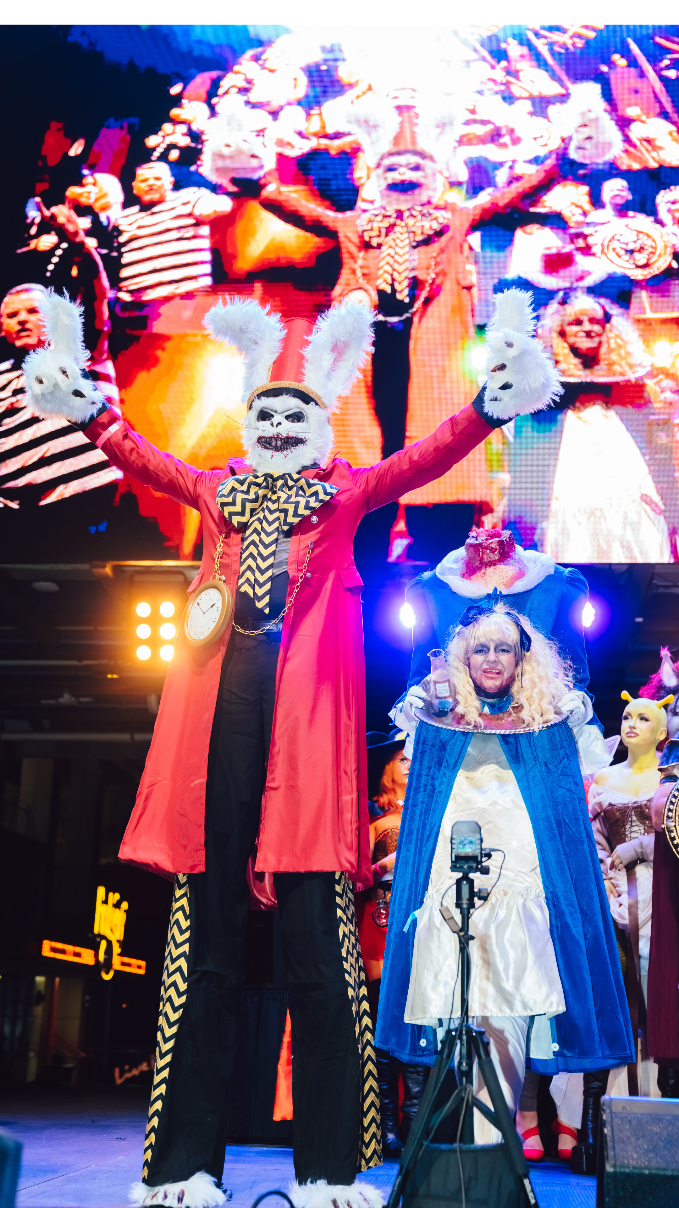 An image of a man and woman on stage in Halloween costumes.