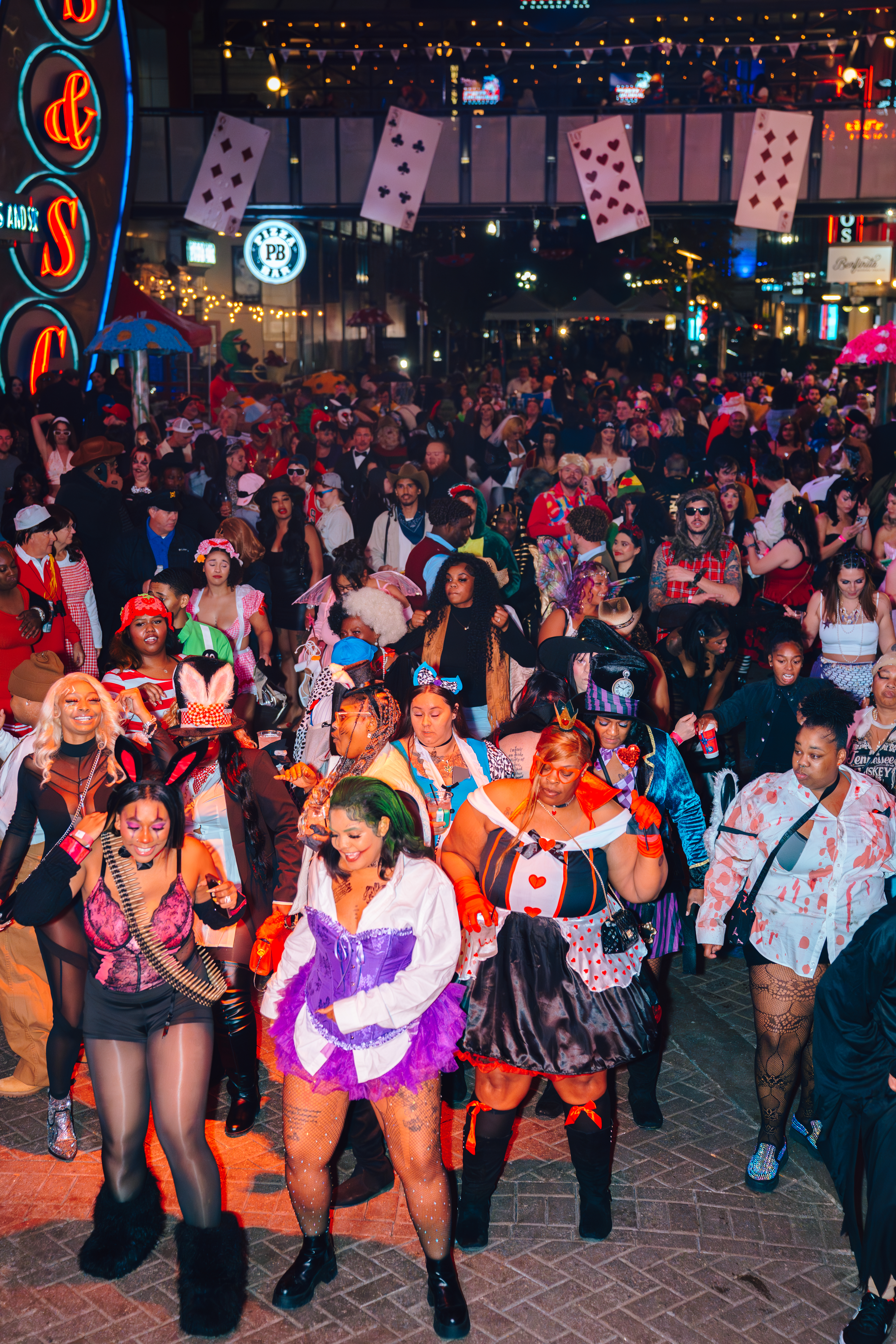 An image of a full street of people at 4th St. Live's Halloween Party.