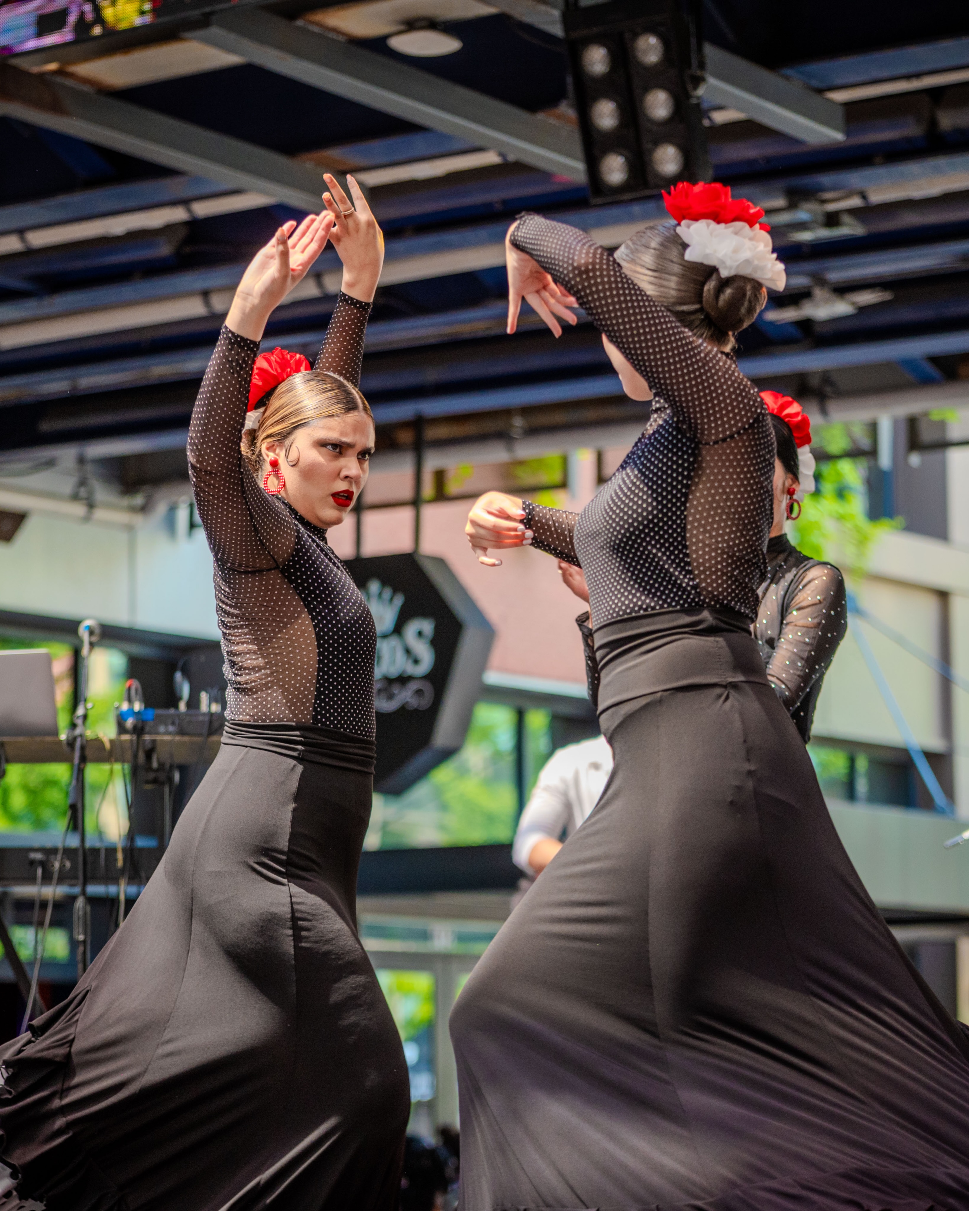 AN image of dancers wearing black dresses at Carnavles de Sweet Havana.