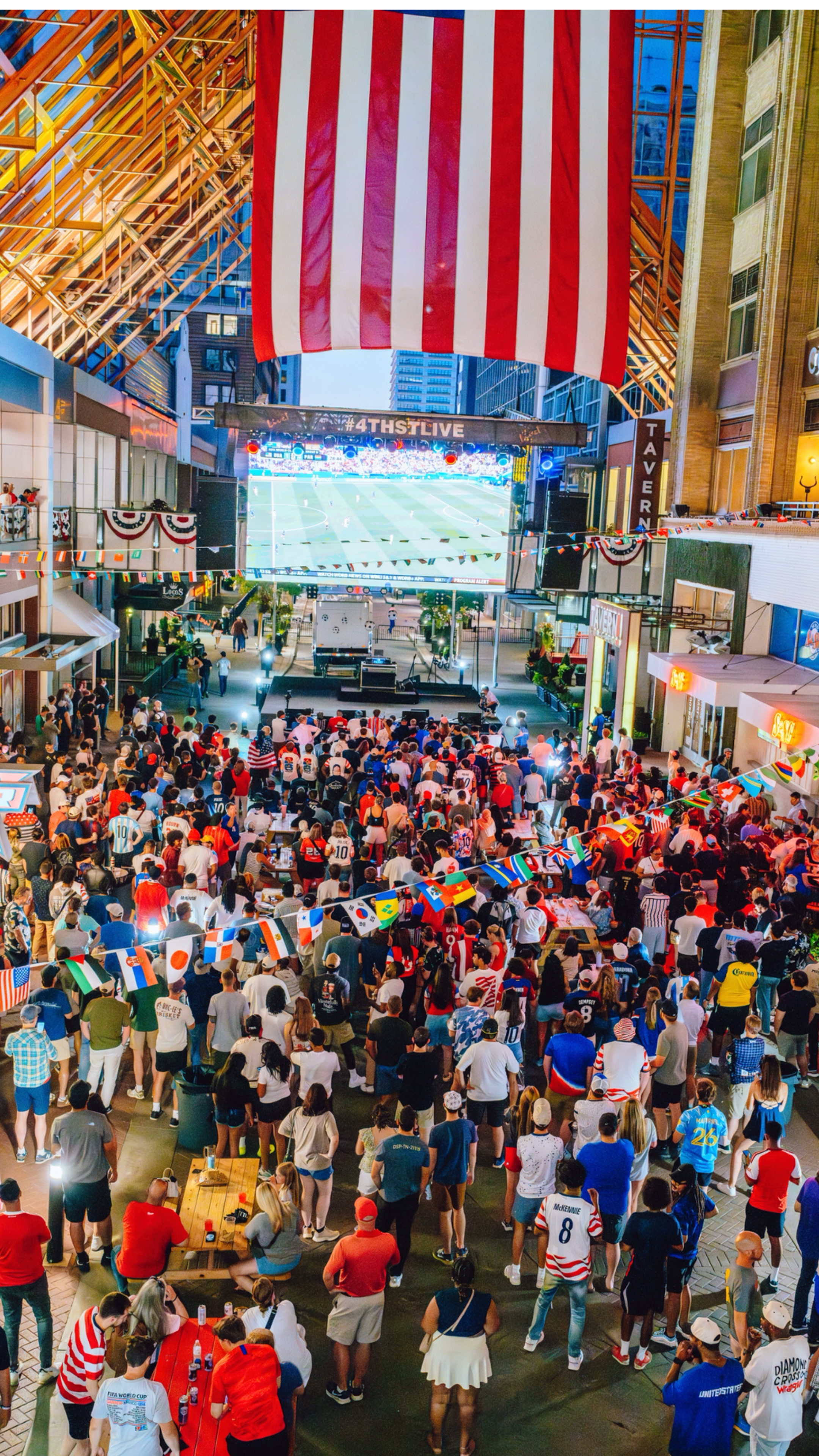 An image of a crowd watching a World Cup game on the big screen at 4th Street Live!