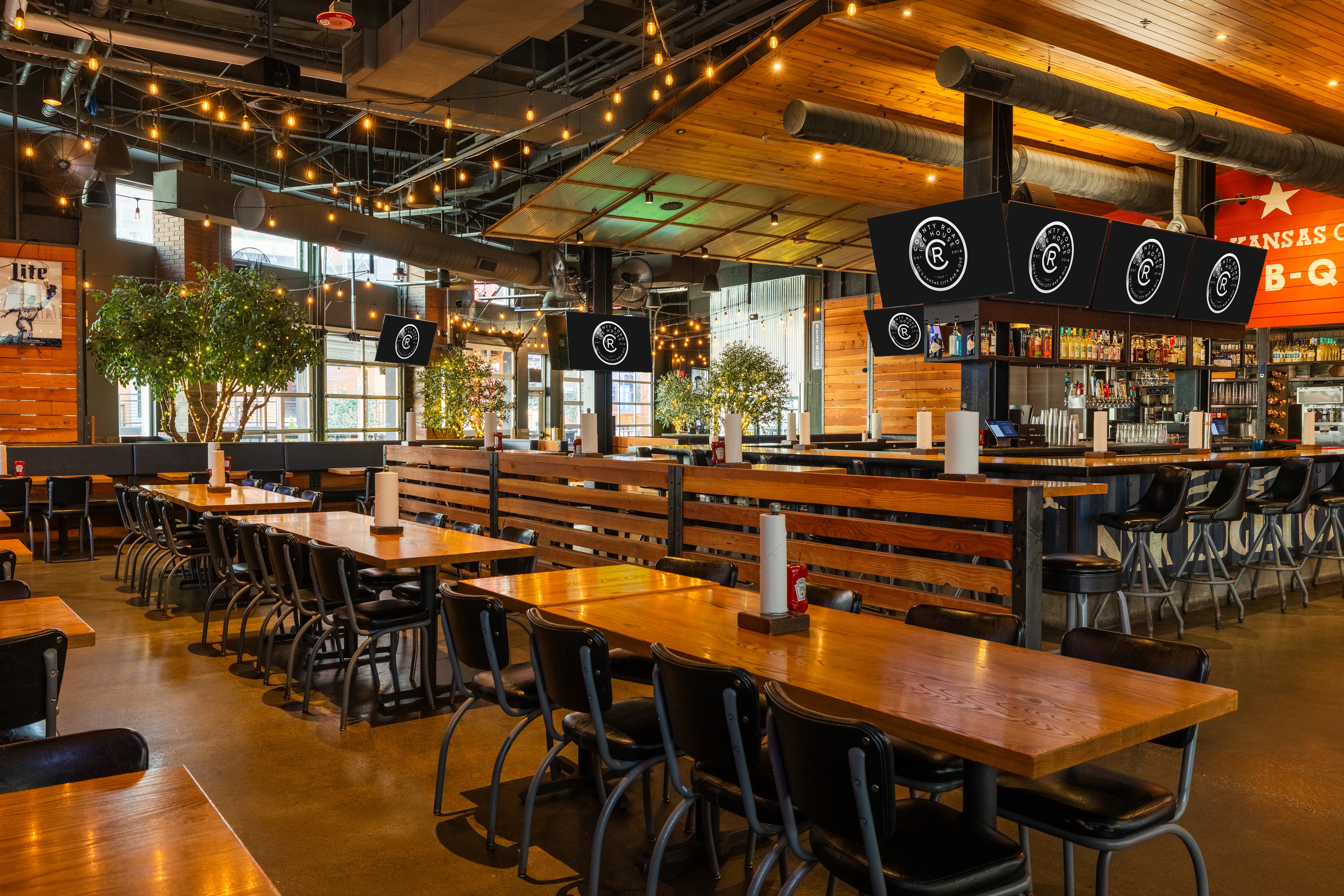 Inside dining area of County Road with patio style seating.