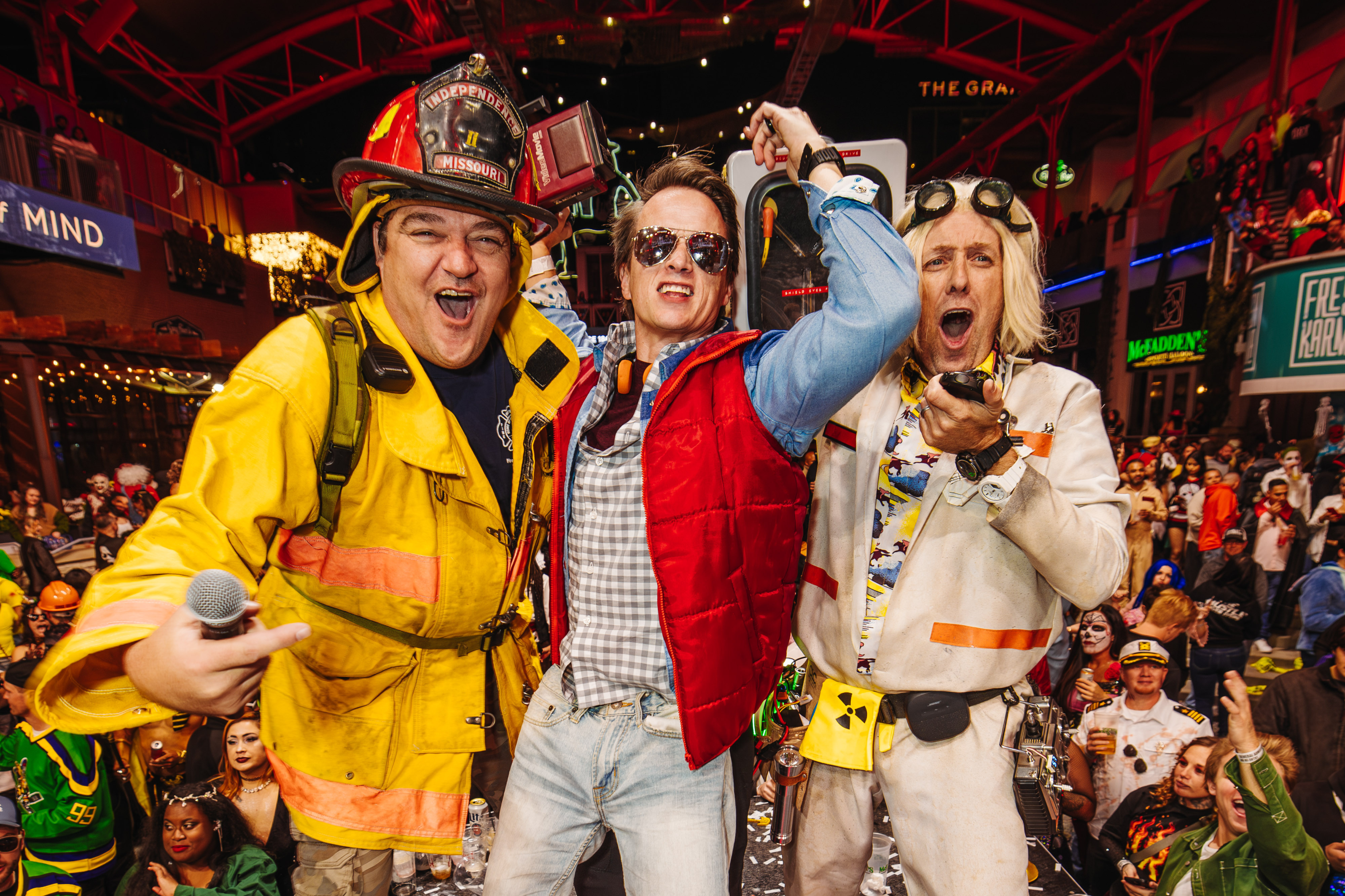 Three men in Halloween costumes