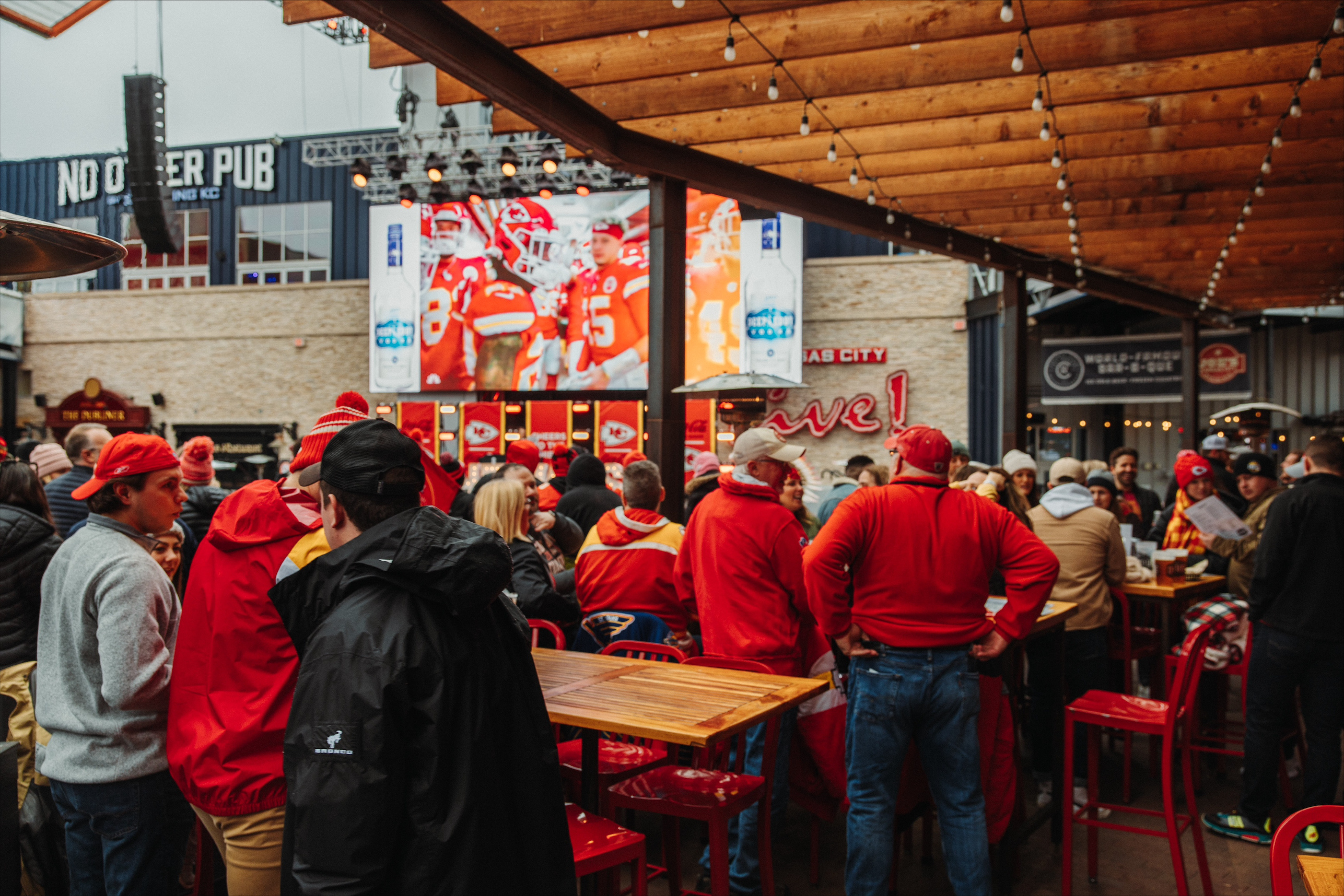 Fans watching the Kansas City Chiefs game from the patio at Guy Fieri's Dive and Taco Joint