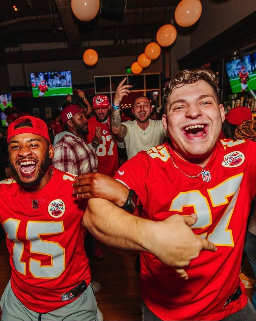 Two men in Chiefs jerseys at McFadden's