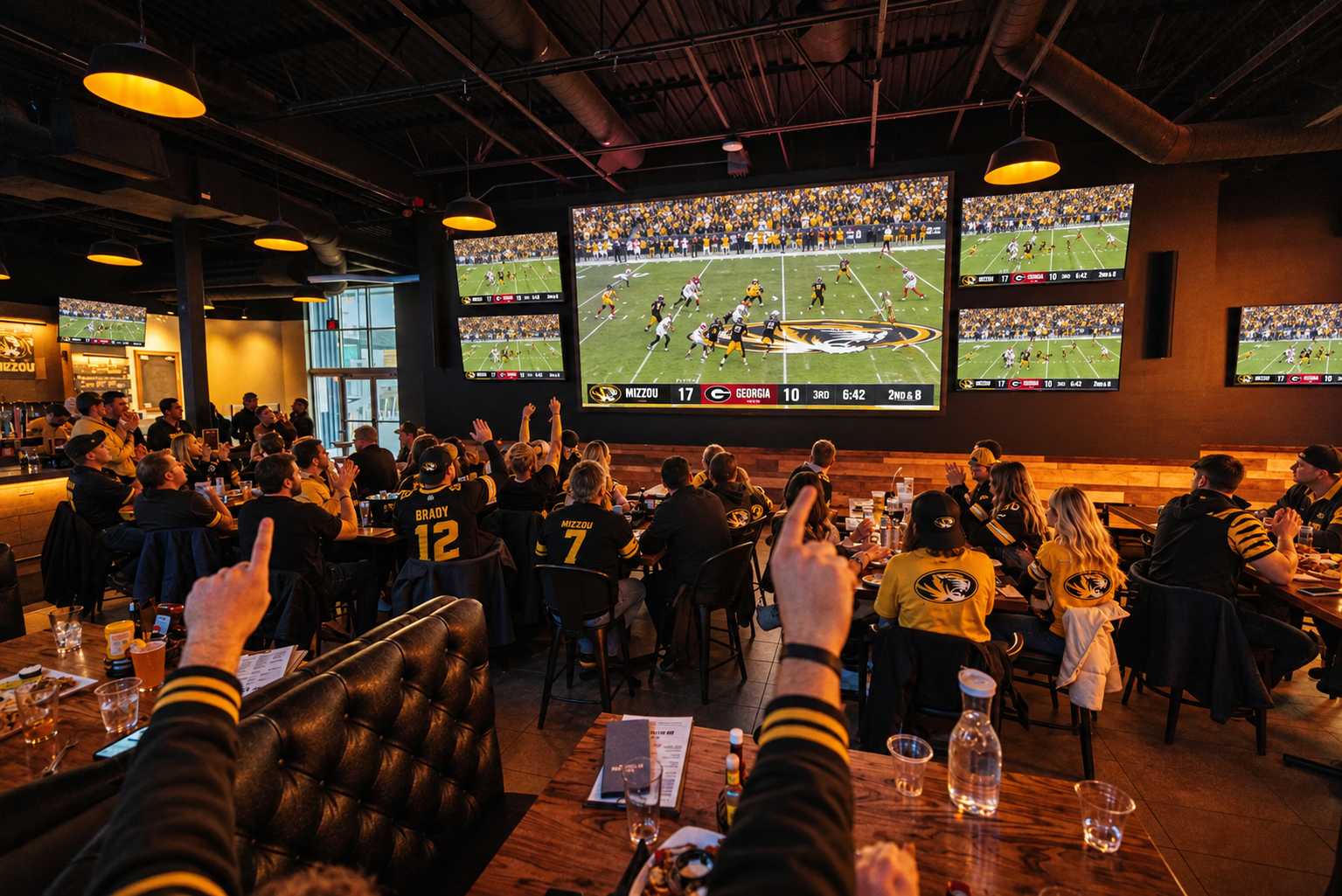 Fans watching Mizzou game on the big screen at No Other Pub