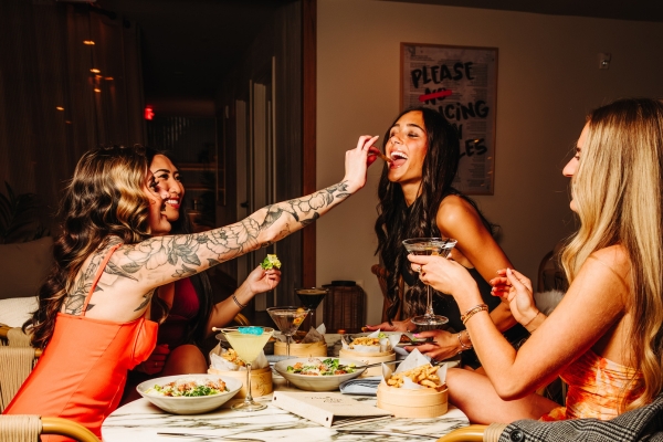 Guests at Palm Tree KC sharing Girl Dinner.