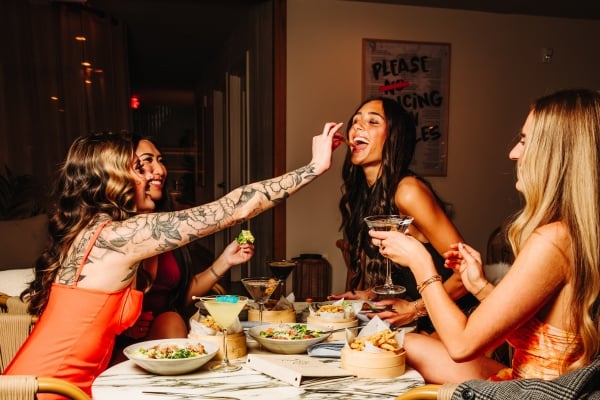 Guests at Palm Tree KC sharing Girl Dinner.