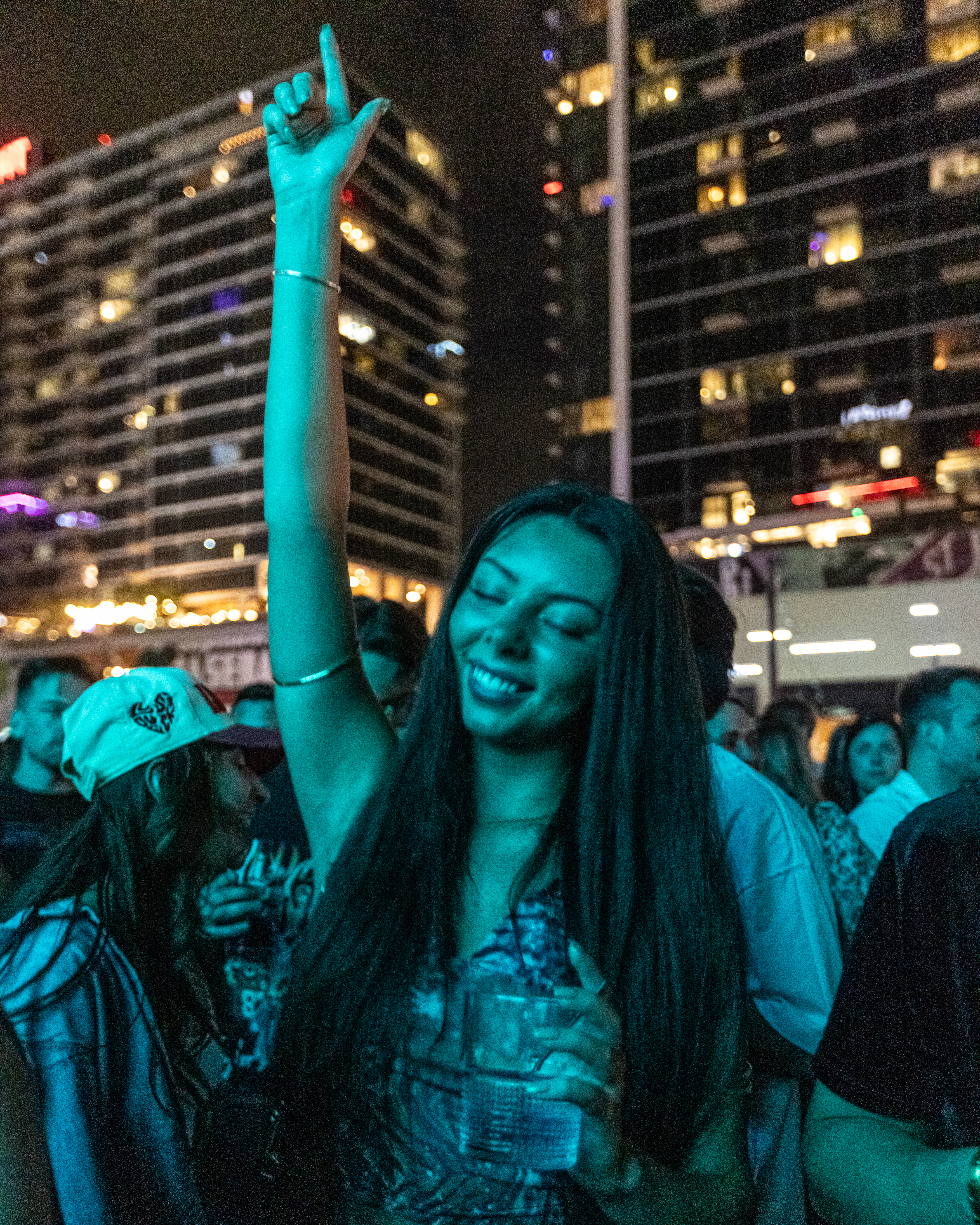 A guest dancing on the rooftop at Palm Tree KC.