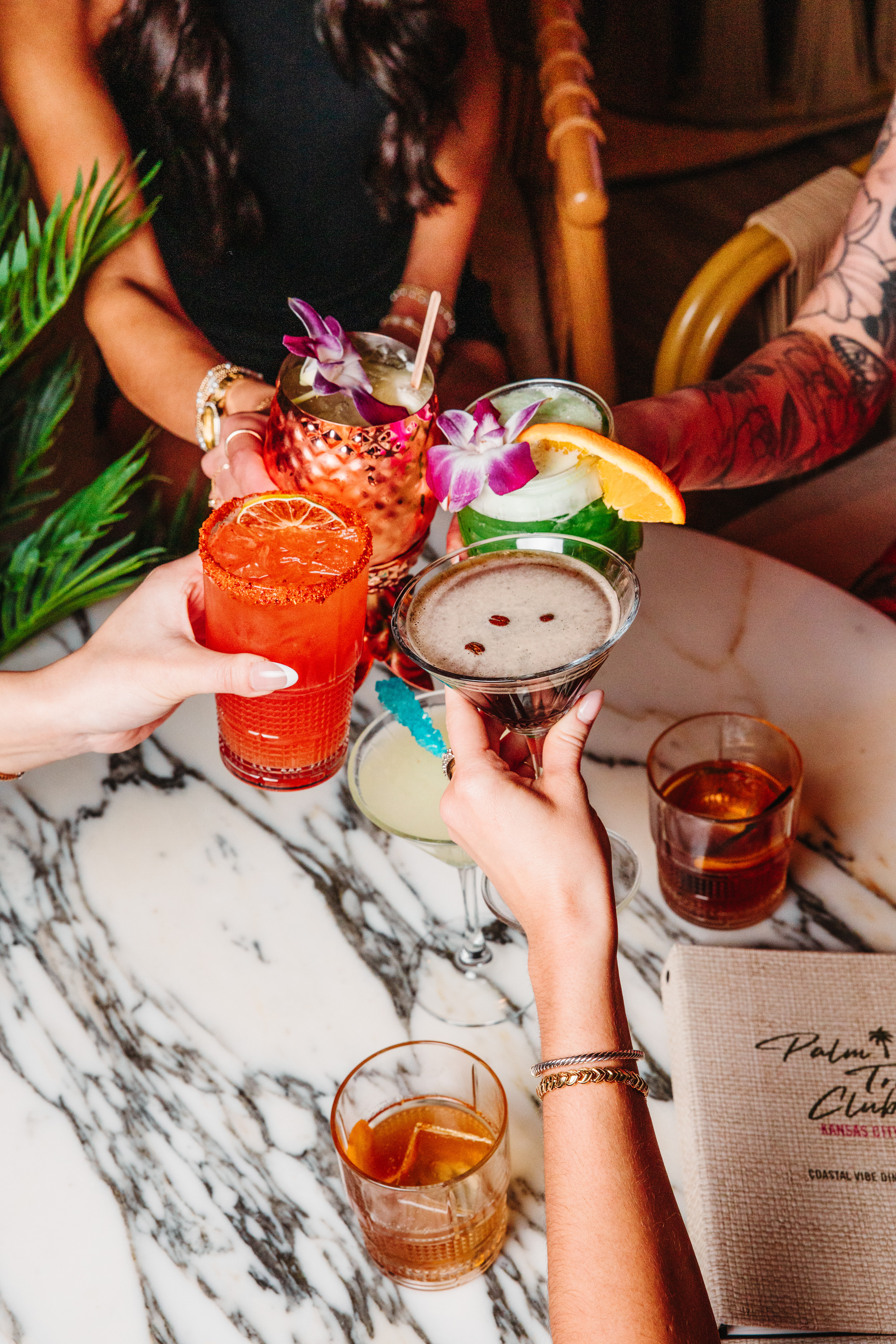 Four signature global cocktails at Palm Tree KC.