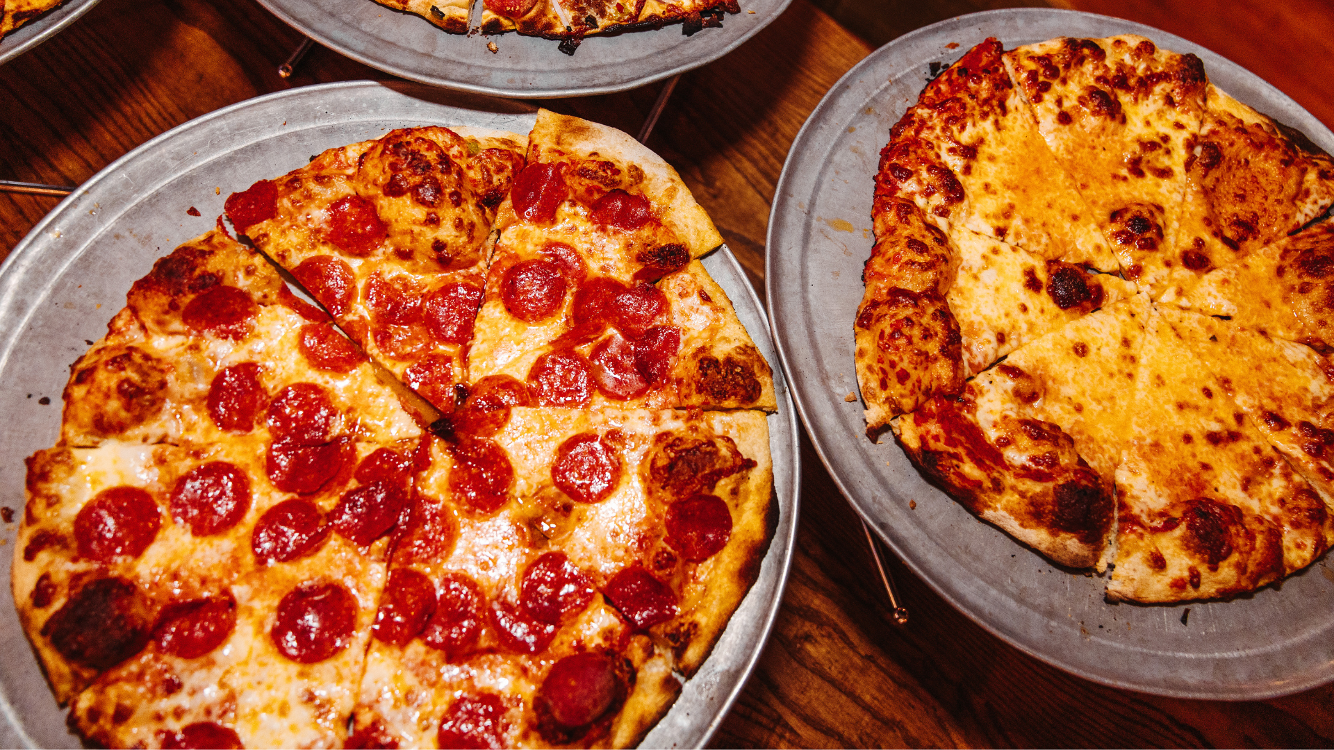 Pepperoni and cheese pizzas