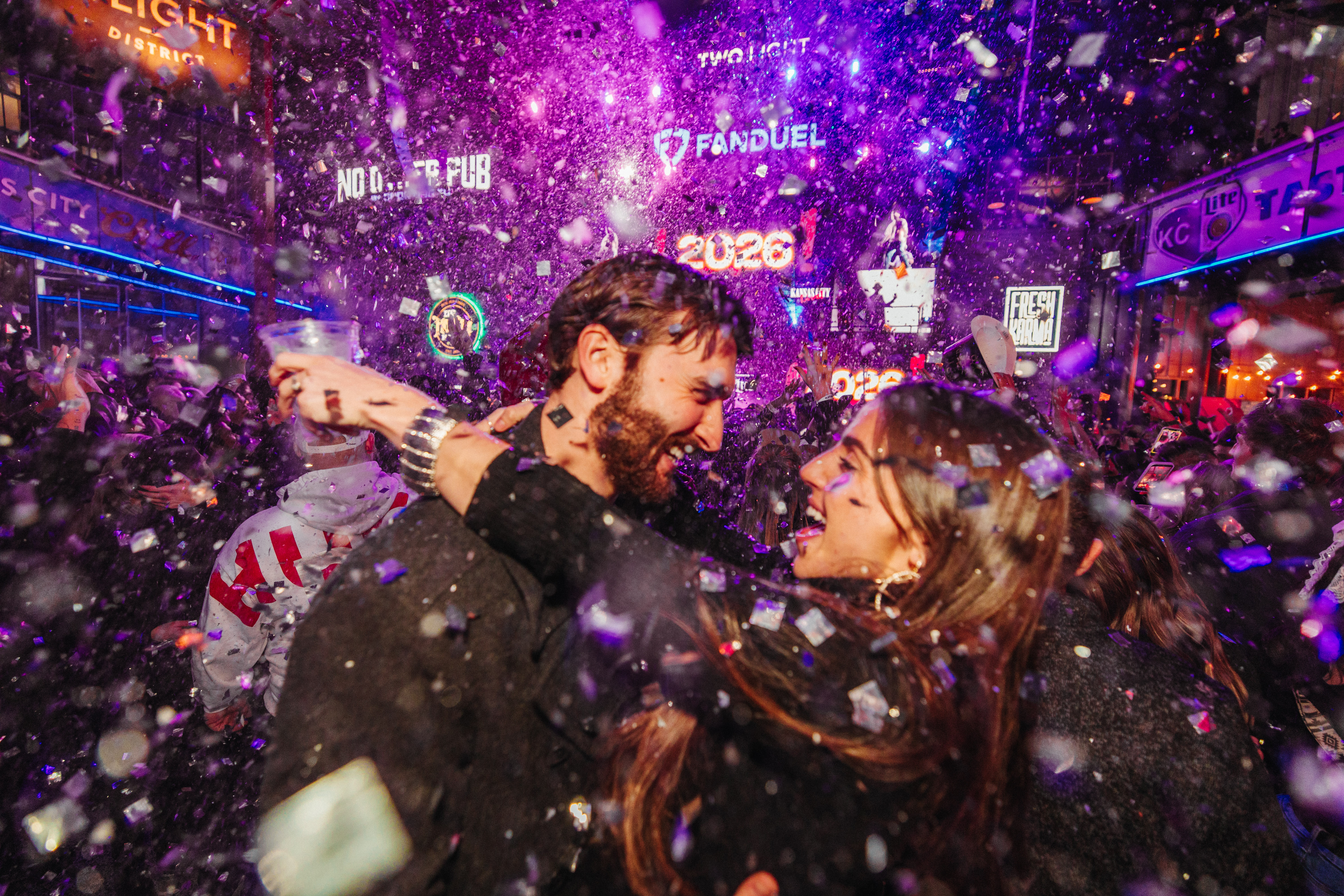 Couple at NYE Live! with confetti