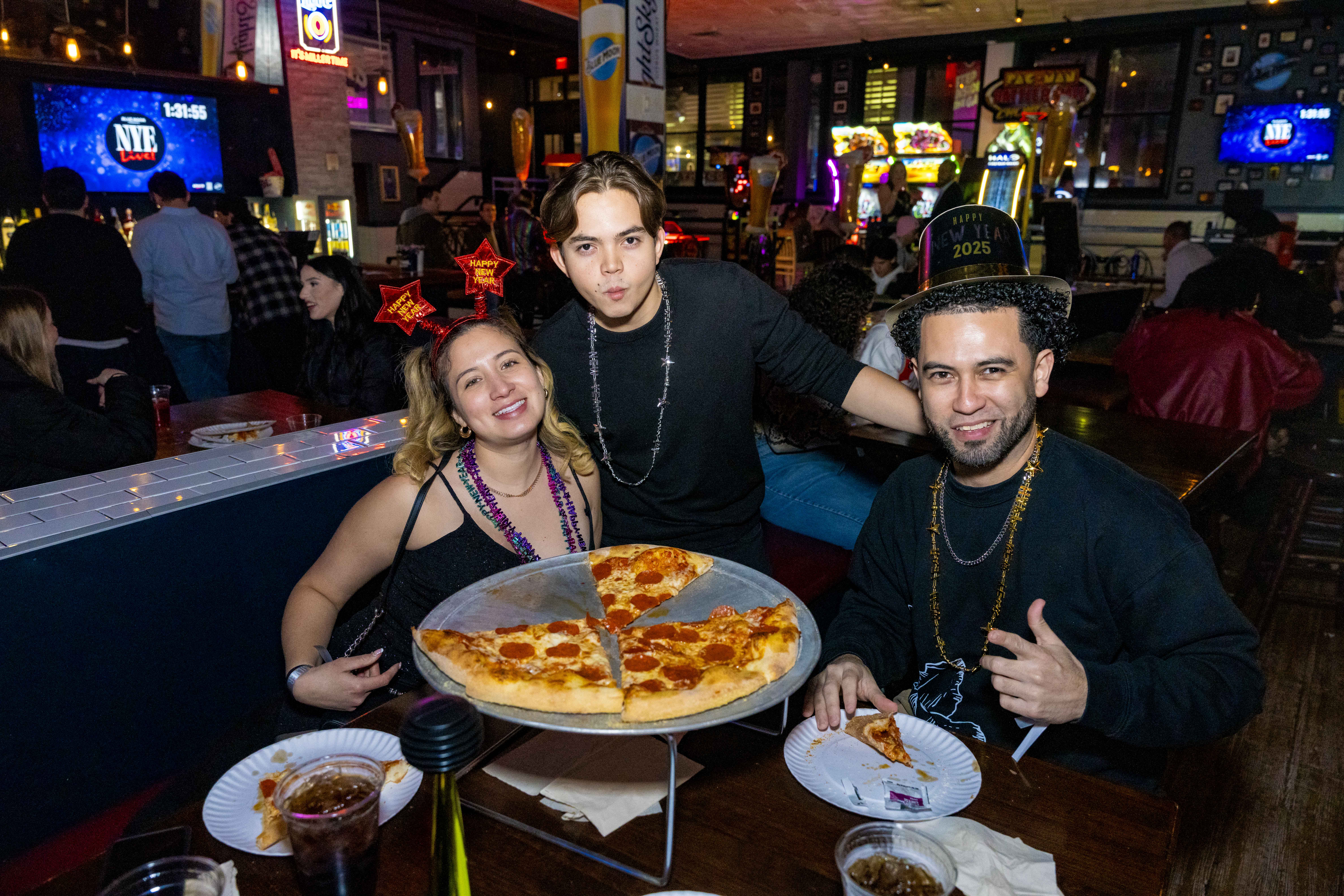 People posing at Pizza Bar