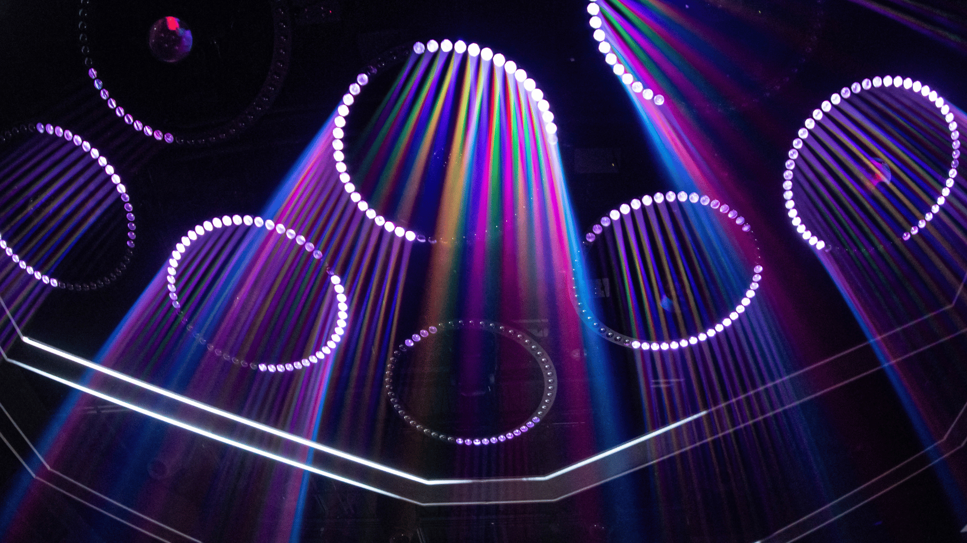 light installation at Mosaic, shining rainbow iridescent lighting