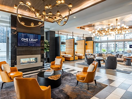 One Light Club Room and Coworking Lounge with open seating and fireplace.