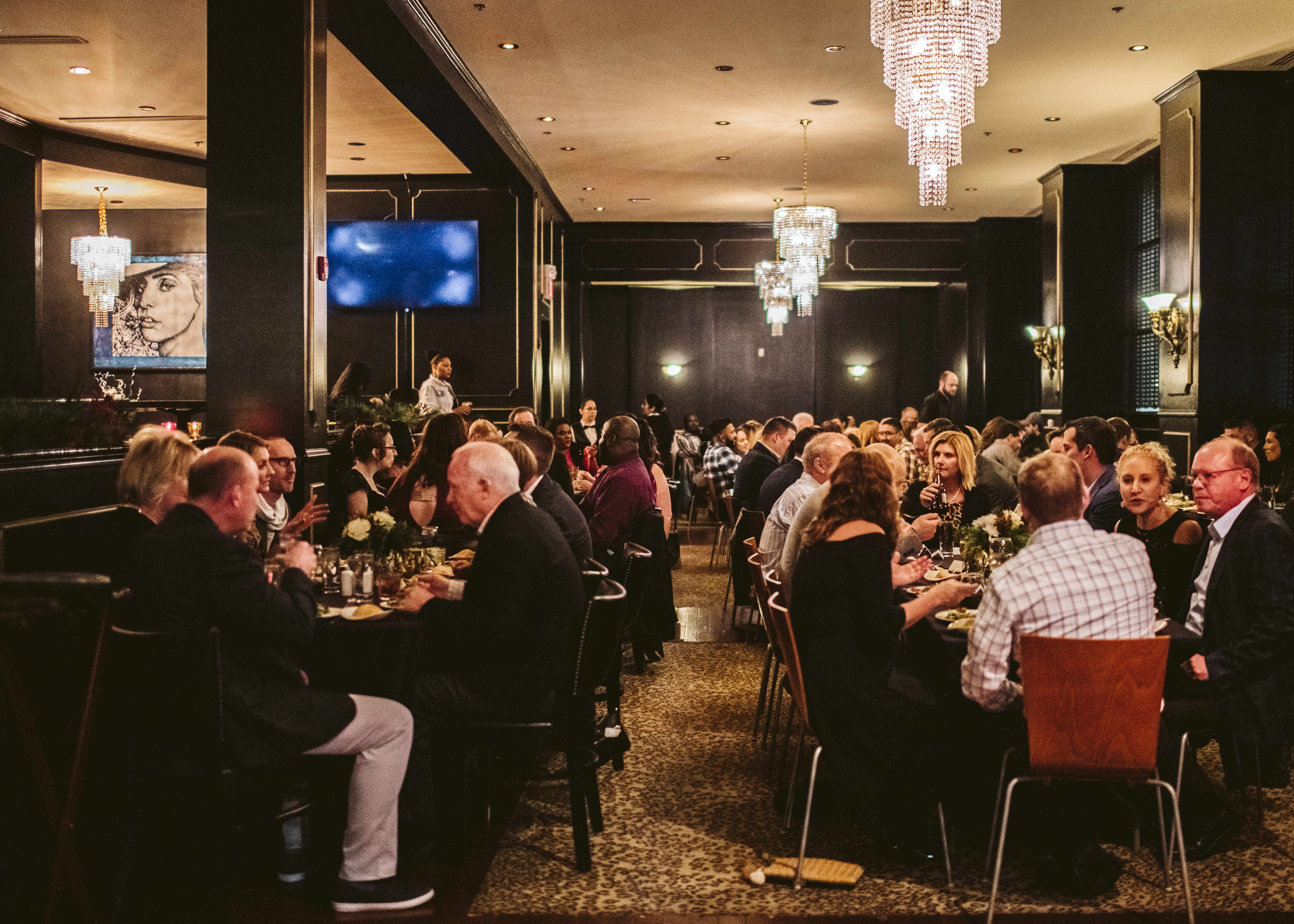 A full room full of guests eating at KDC.
