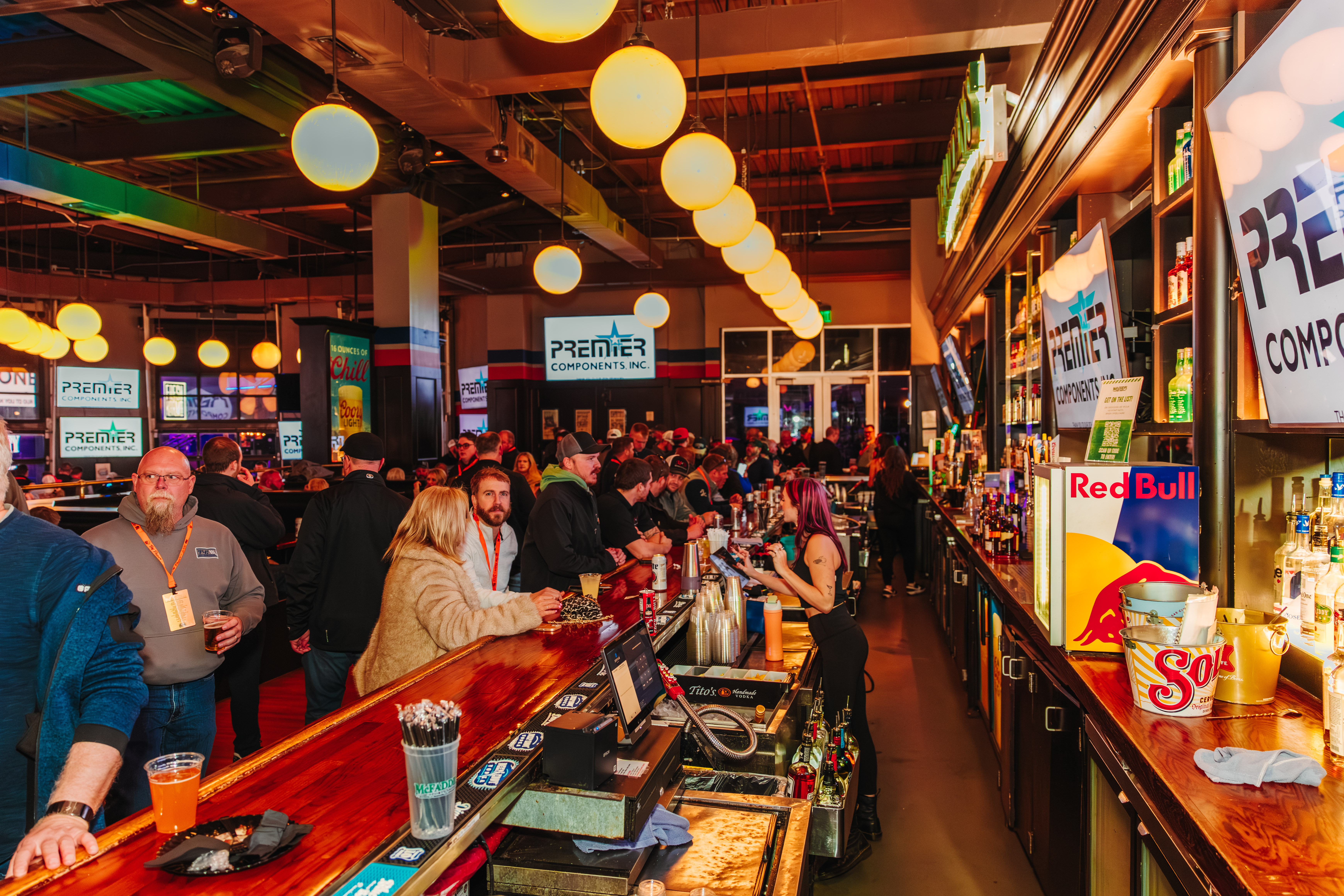 Patrons attending a private event sitting at the bar at McFadden's.