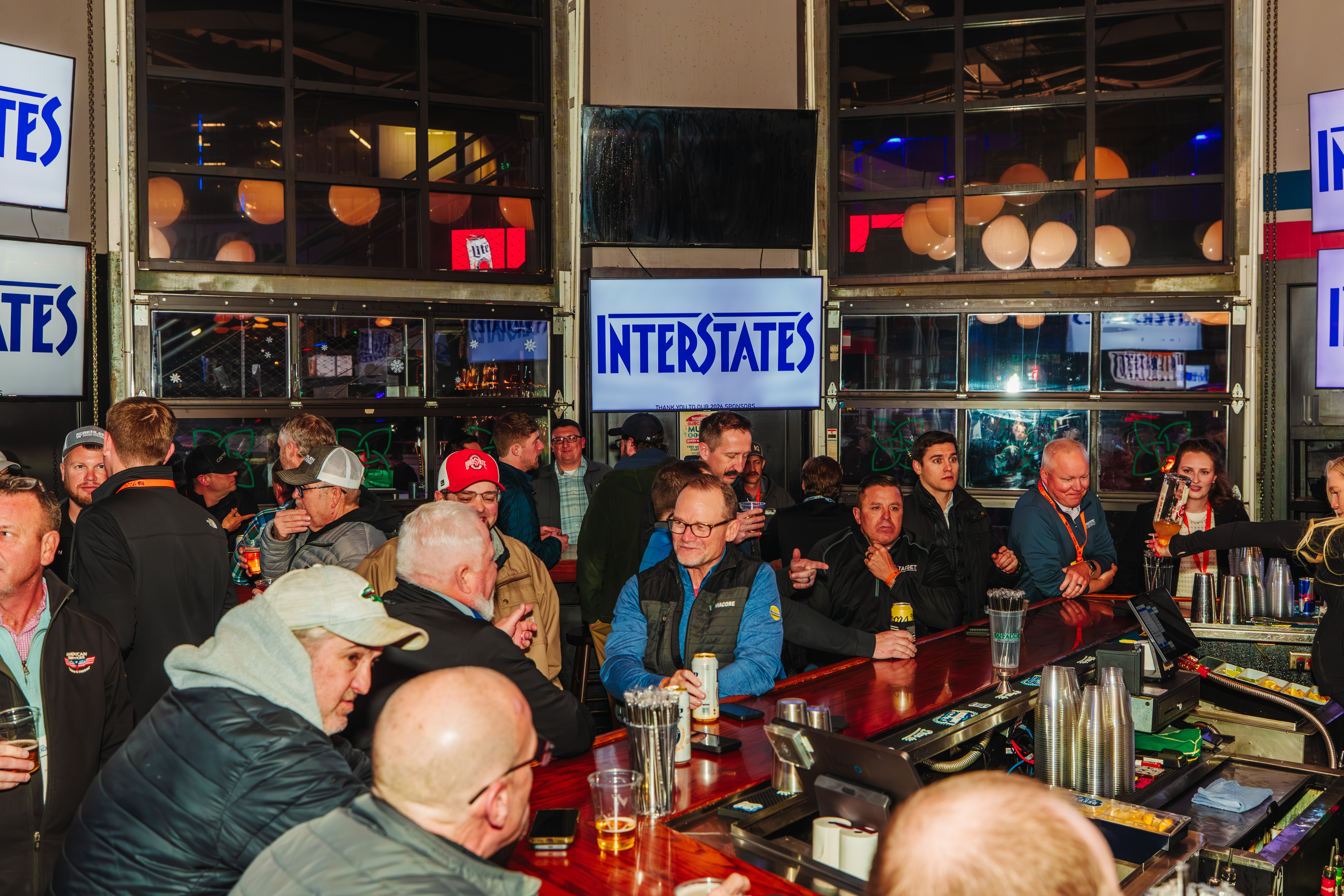 Patrons at the bar attending a corporate event at McFadden's.