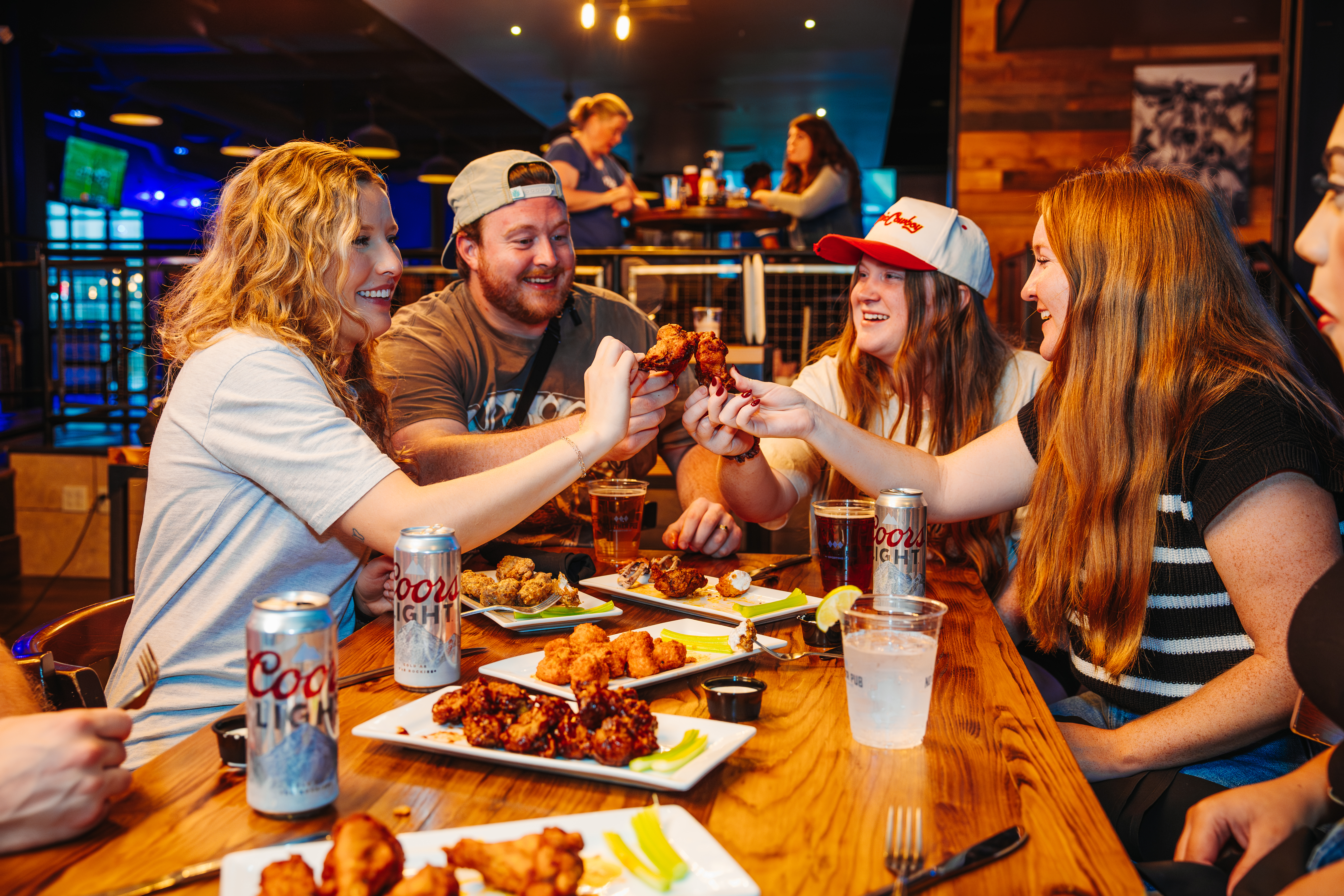 Guests enjoying food and drinks at No Other Pub.