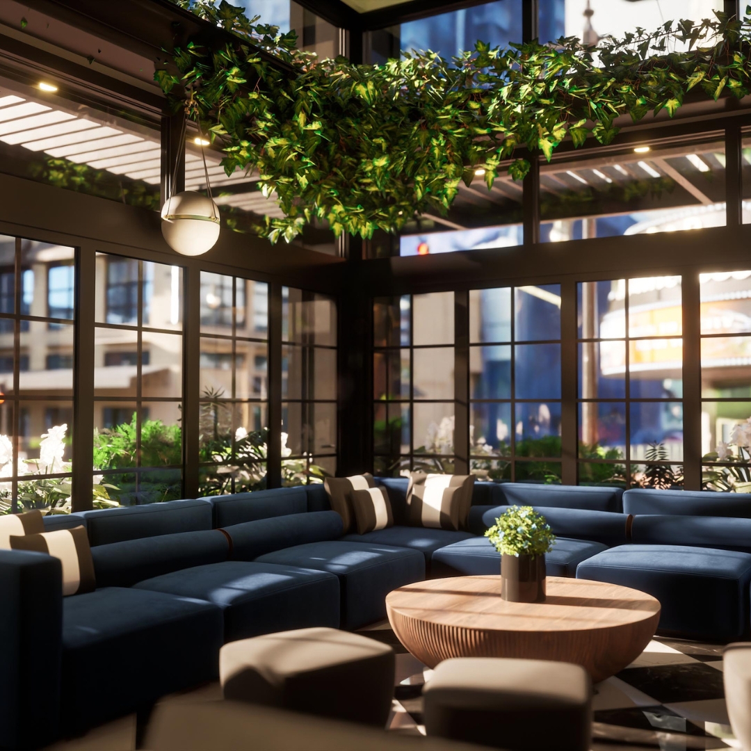 Plush couches and foliage on the patio at The Residence.