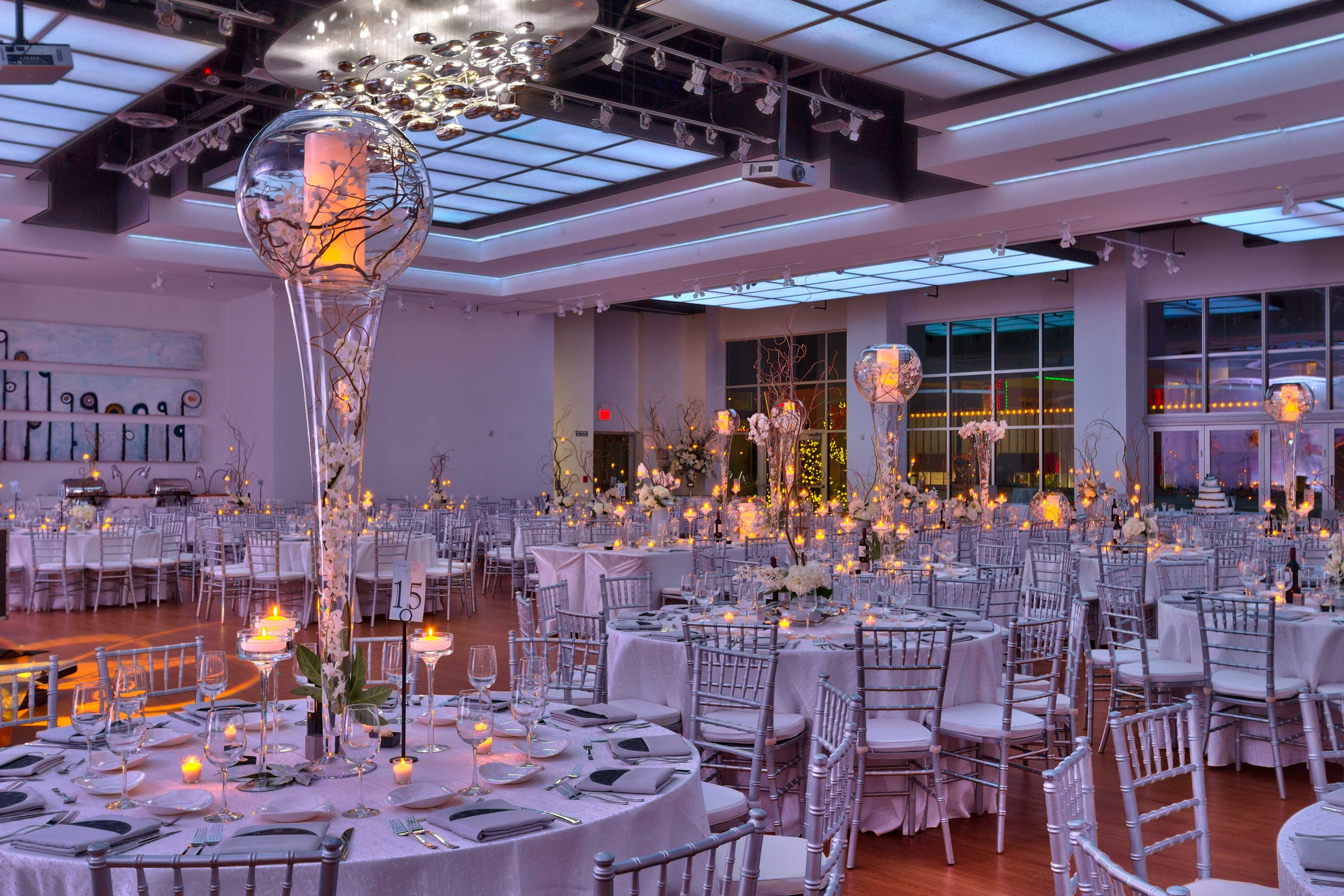 The Gallery interior set up with tables and custom lighting for corporate event.