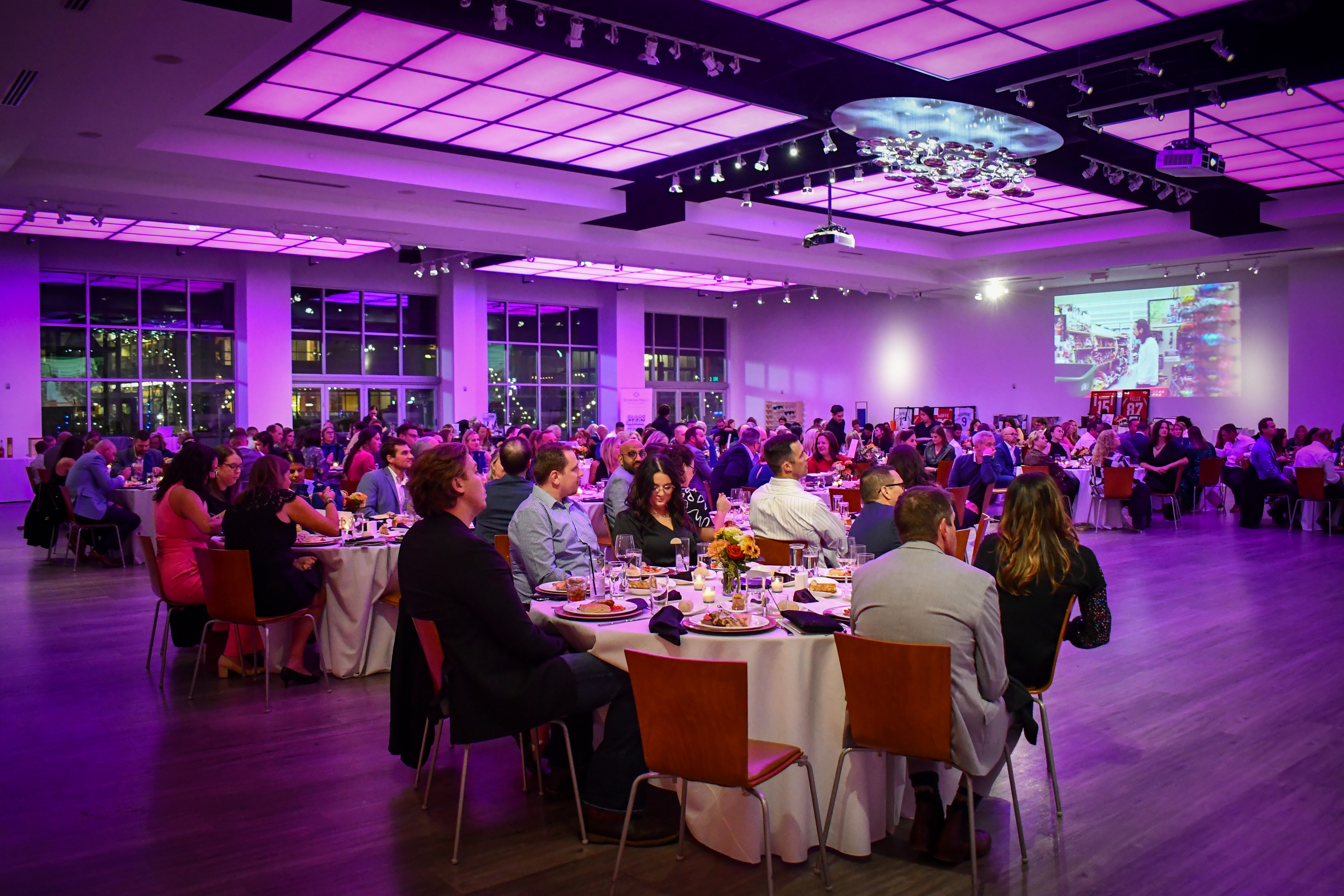 The Gallery interior set up with tables and lighting for a corporate gala.
