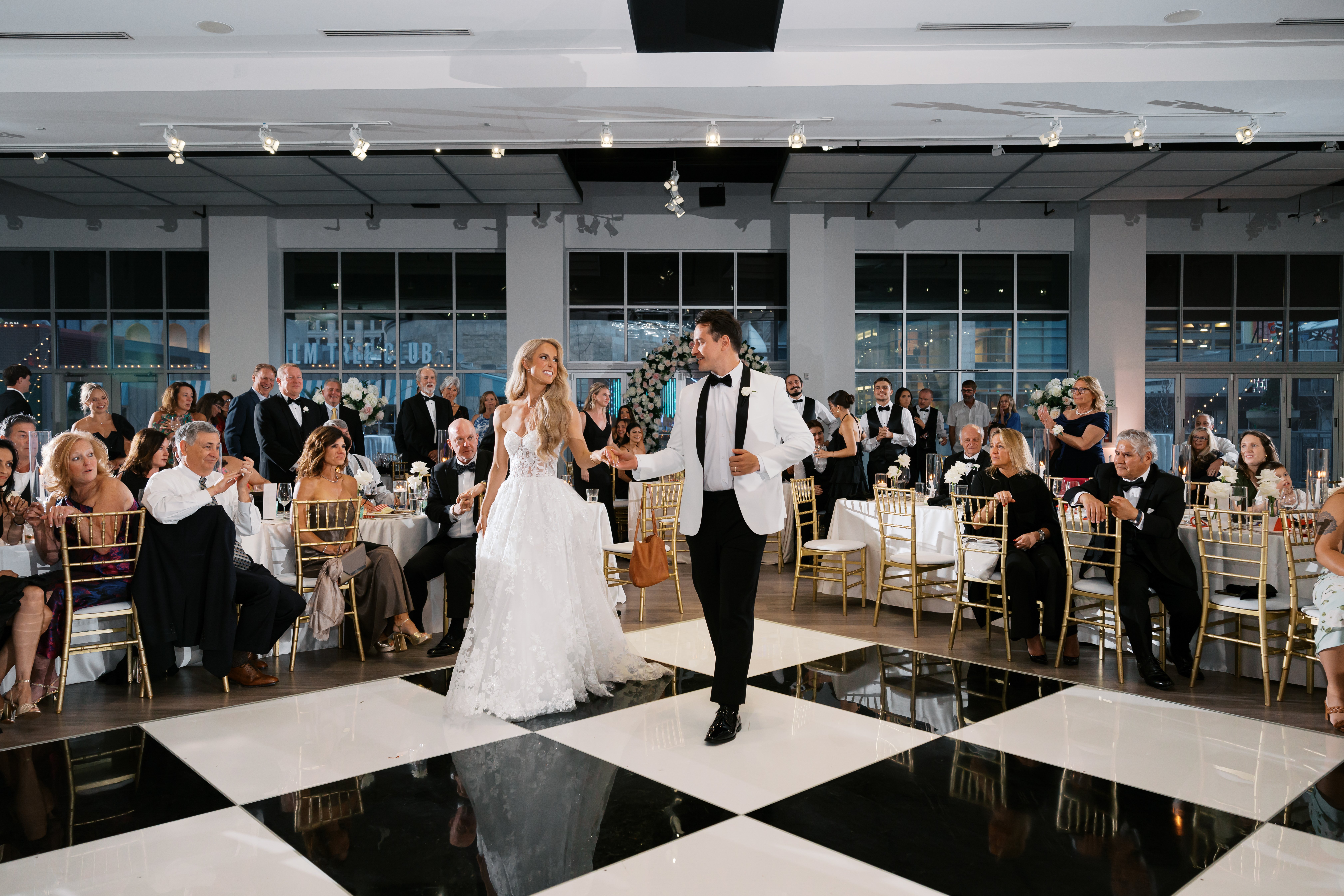 A bride and groom take the dance floor at their reception at The Gallery.