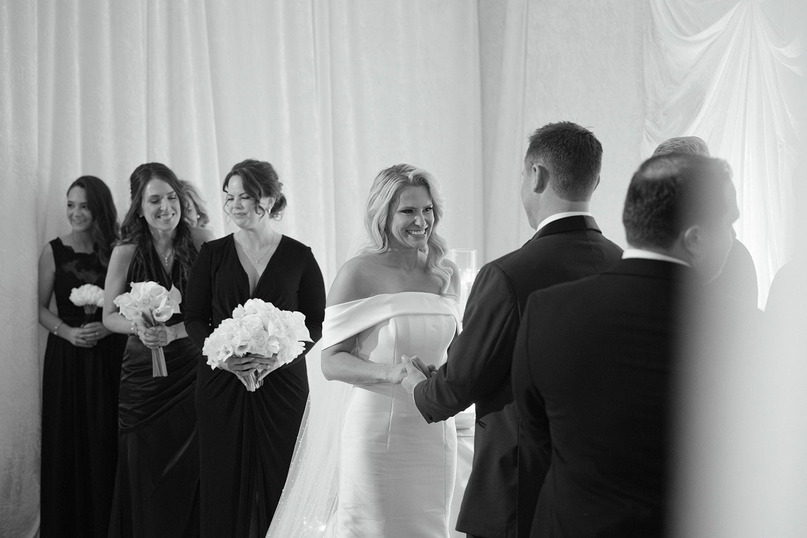 A bride and groom at a ceremony inside The Gallery.