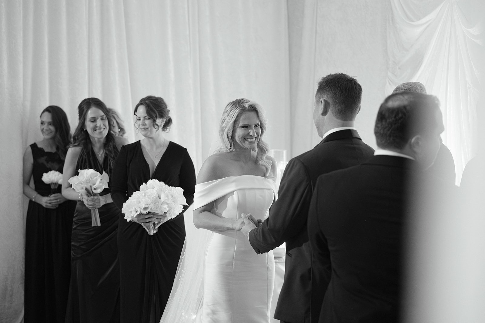 A bride and groom at a ceremony inside The Gallery.